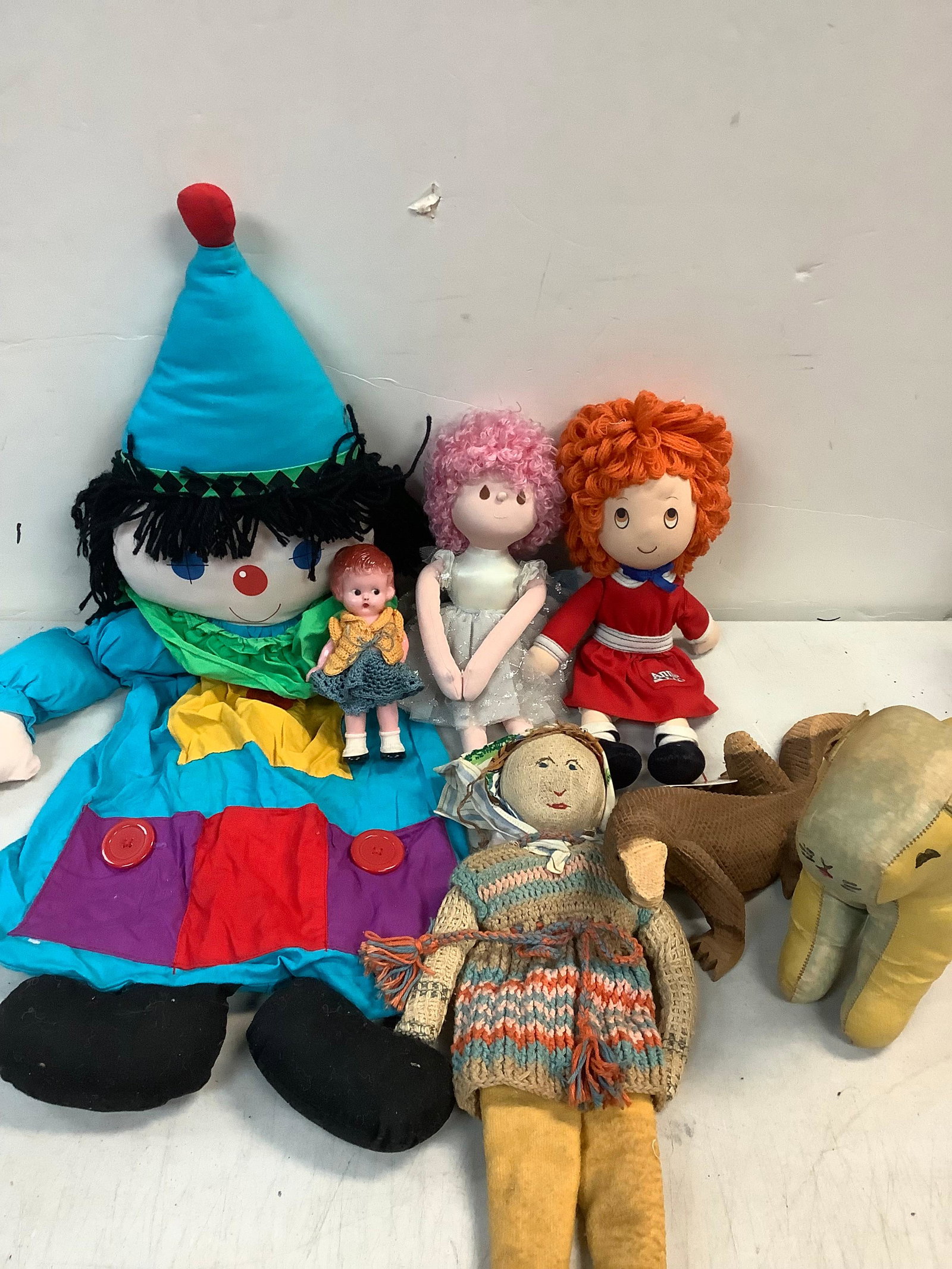 Various stuffed dolls, vintage leather dog, wooden lizard (1 of 1)