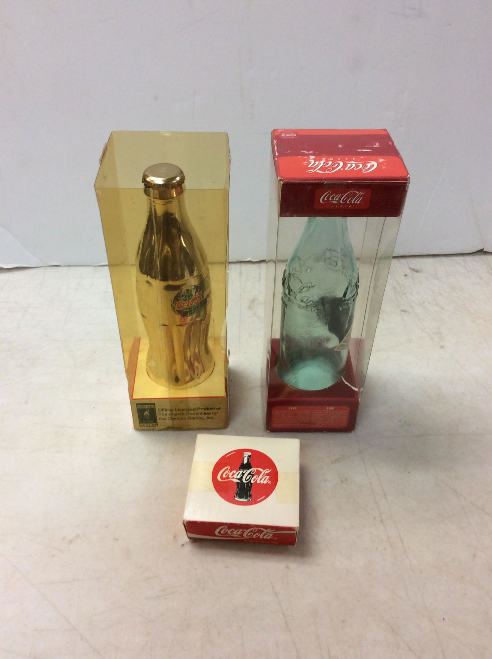 Lot of vintage coca cola bottles about 9in.tallx3in.wide and collectible box: Lot of vintage coca cola bottles about 9in.tallx3in.wide and collectible box