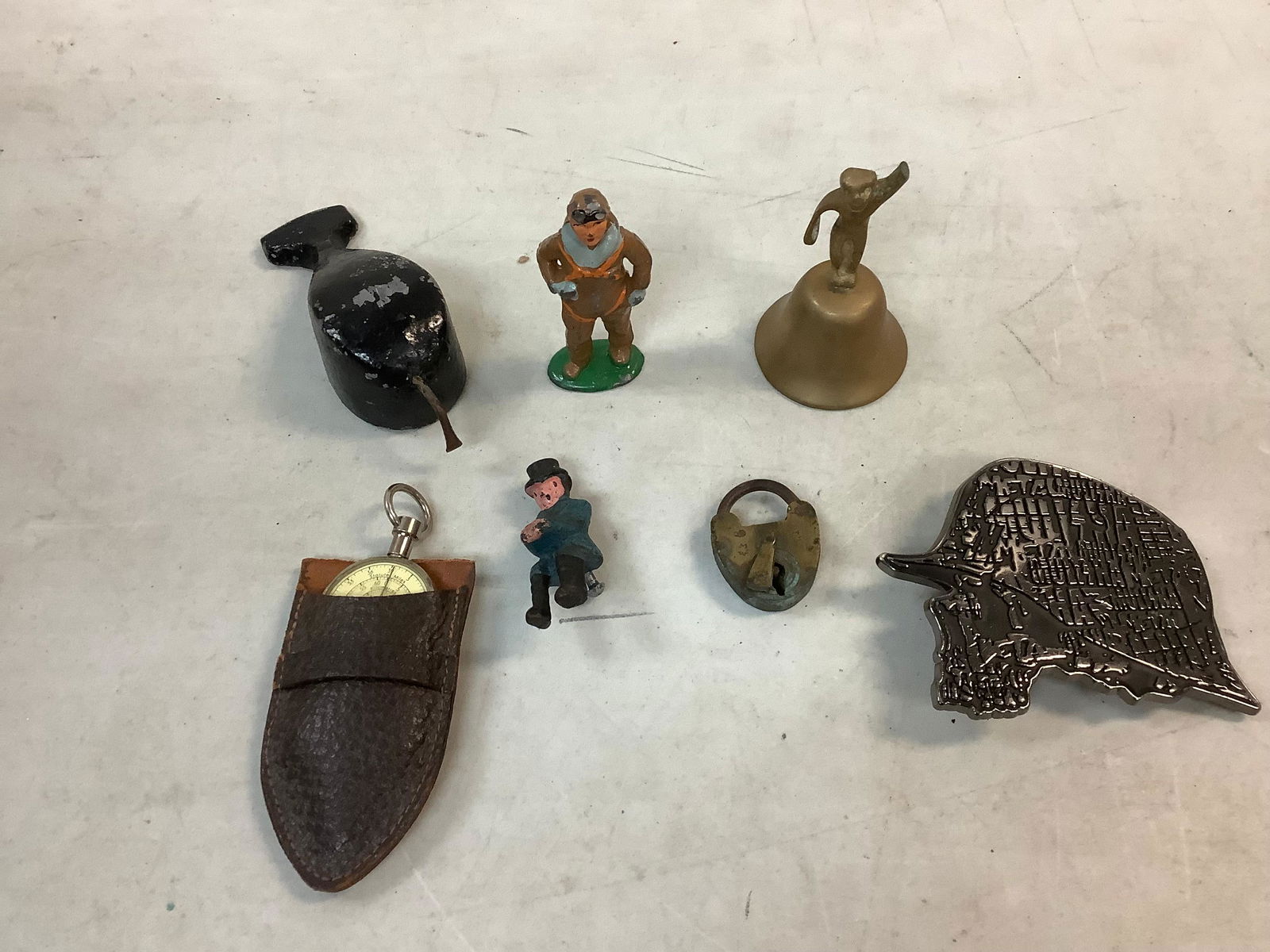 Lot of castiron paper weight, brass bell, toy figures, german compass and more tallest 3.25in tall (1 of 1)