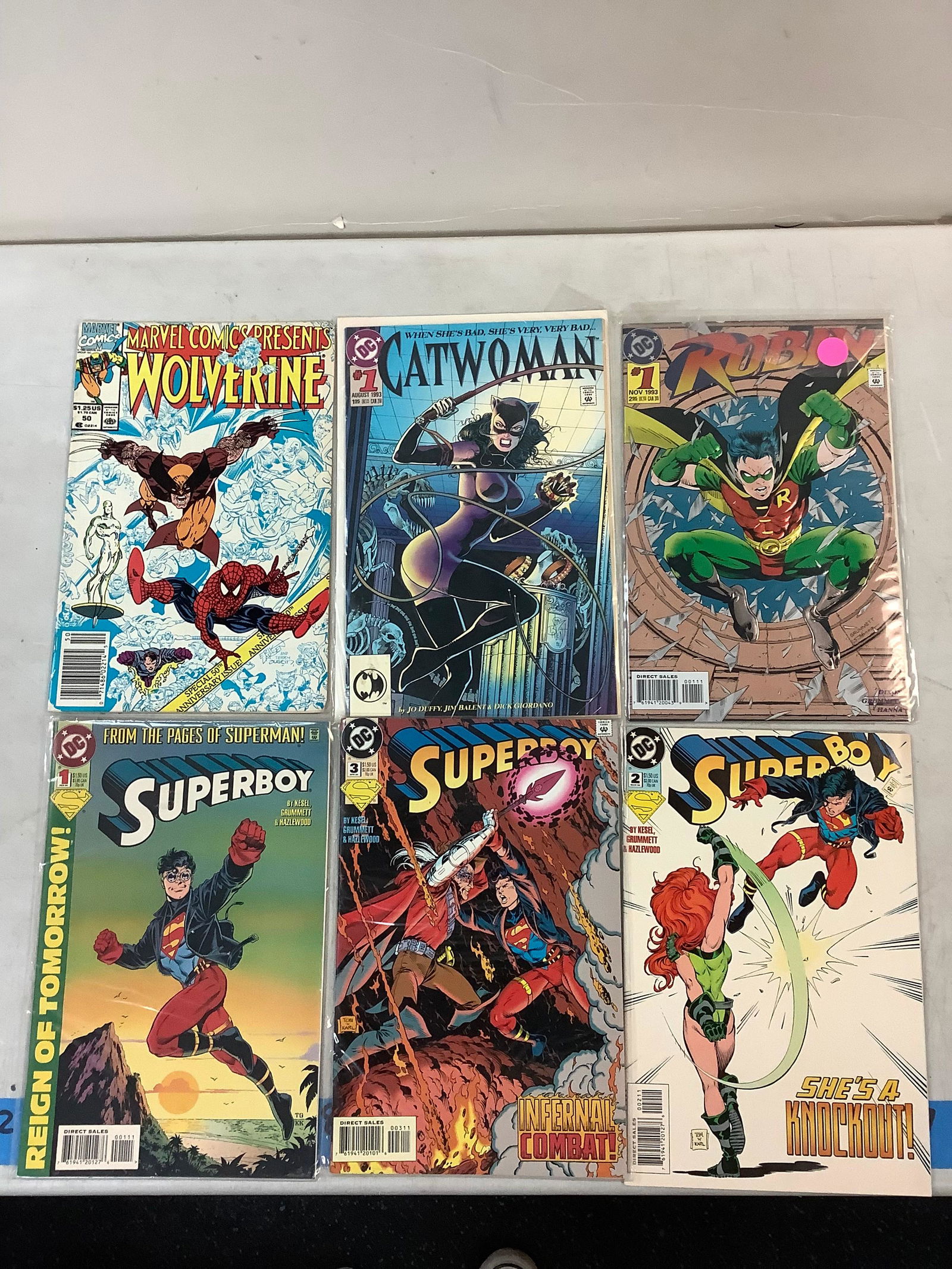 Lot of DC comics and 1 marvel comic some names inculuding Wolverine, Robin, Superman, etc (1 of 1)