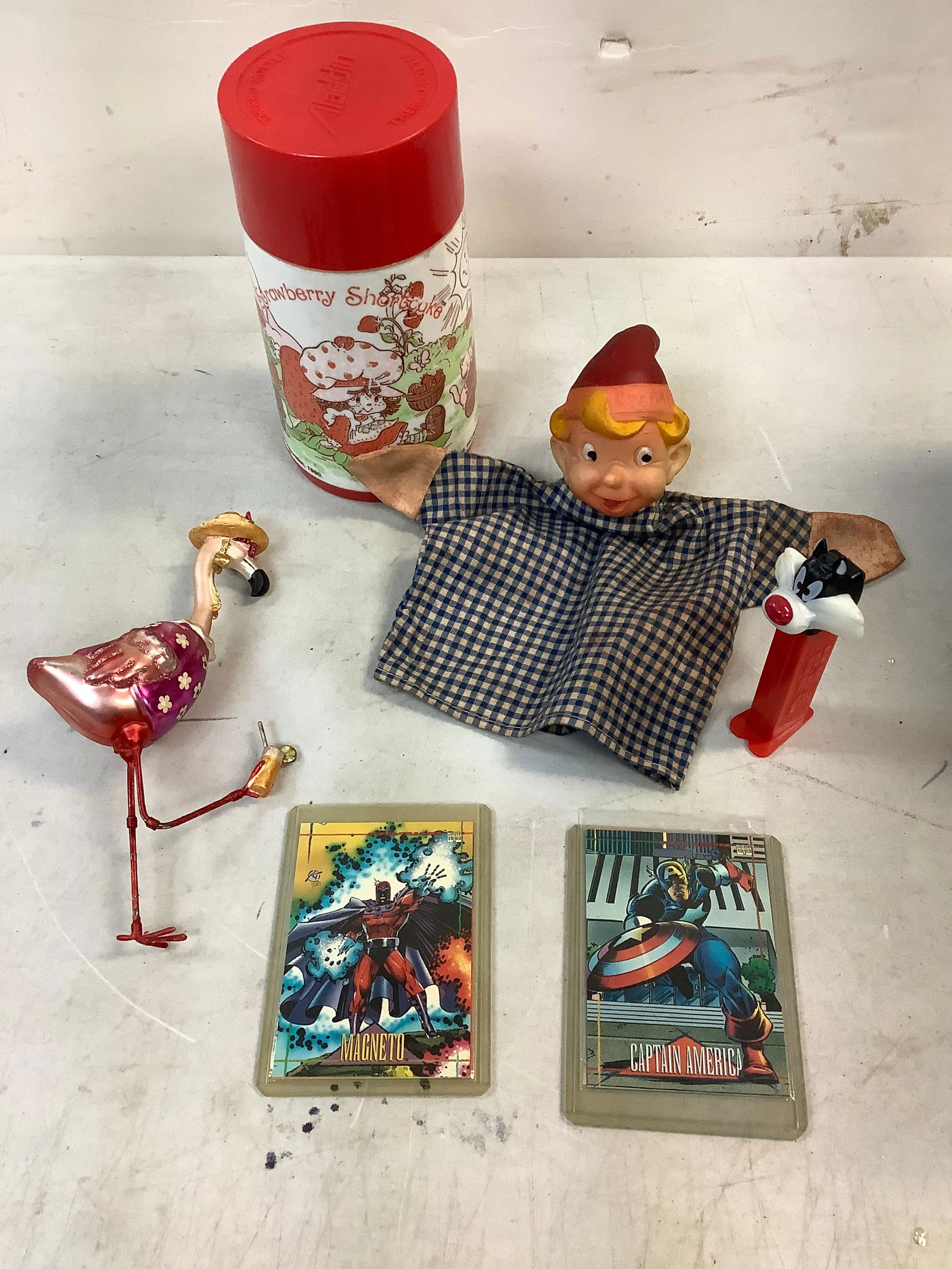 Lot of loony tunes PEZ dispensor, Strawberry shortcake thermos, Marvel cards in sleeves and more: Lot of loony tunes PEZ dispensor, Strawberry shortcake thermos, Marvel cards in sleeves and more