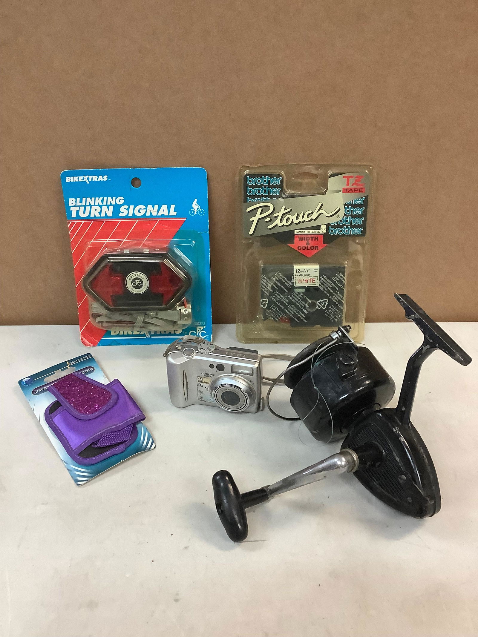 Lot of fishing reel, Blinking turn signal, Cell phone case, camera and p-touch red ink cartirage (1 of 1)