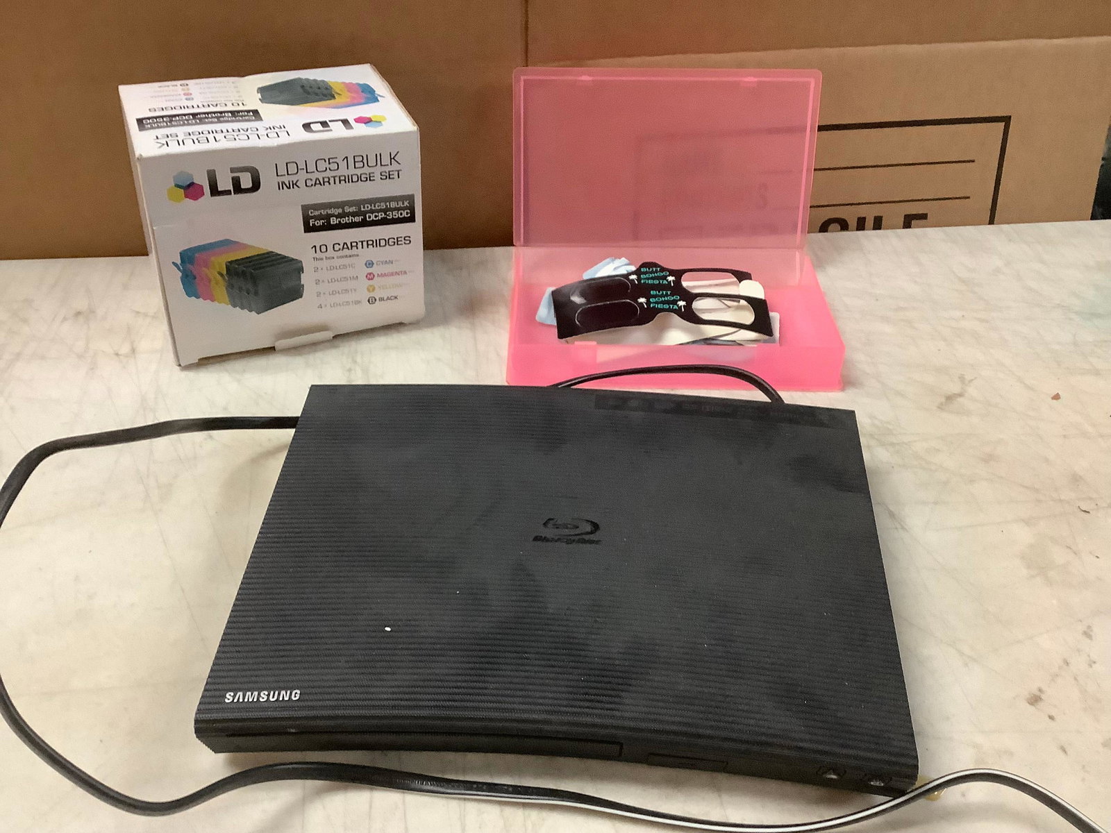 lot of blu ray dvd player, box of 3d glasses, and ink cartridges (1 of 1)