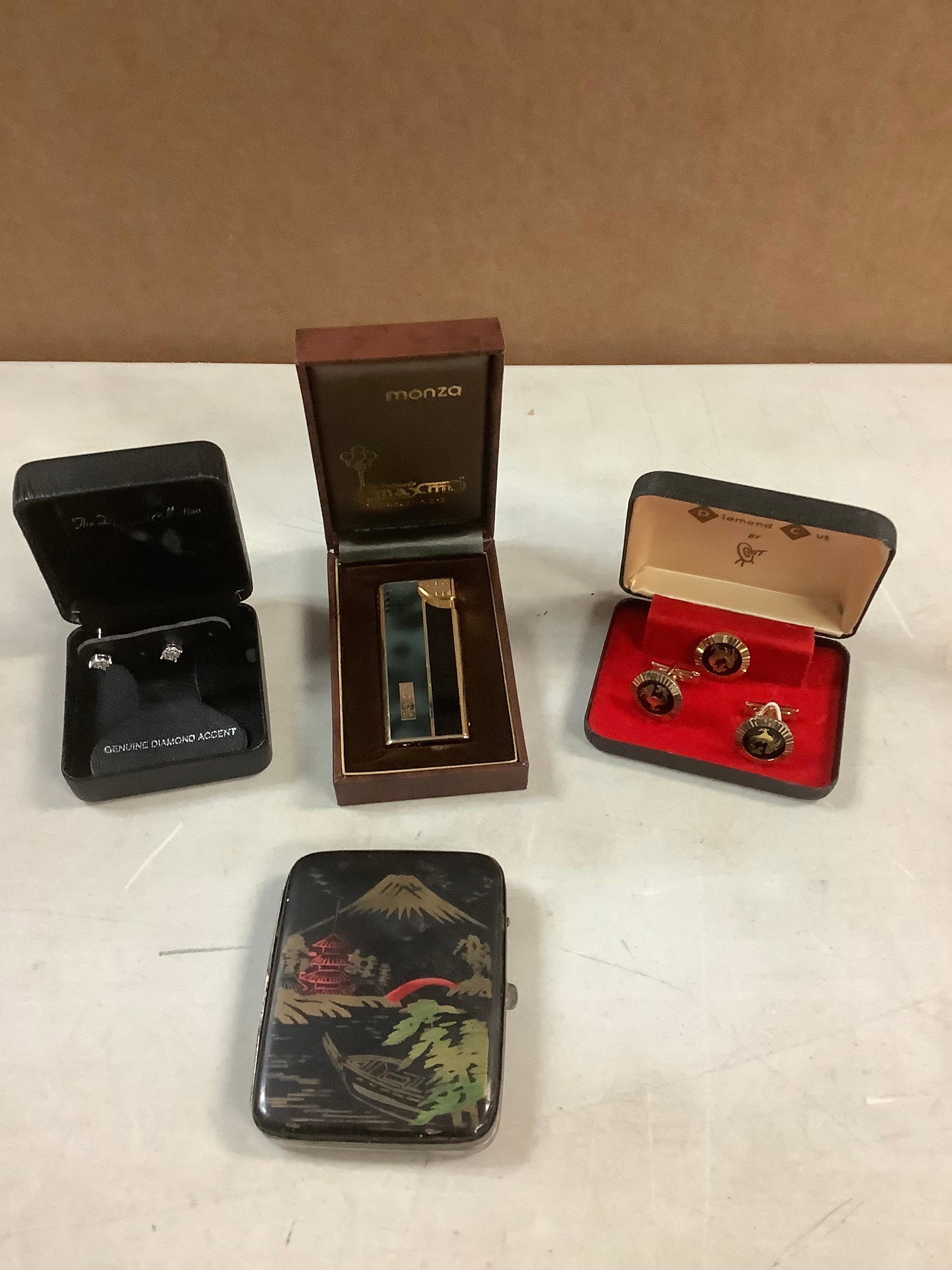 Lot of Monza Lighter, Hit Diamond Cut Cufflinks, Genuine Diamond Accent Earrings and Vintage: Lot of Monza Lighter, Hit Diamond Cut Cufflinks, Genuine Diamond Accent Earrings and Vintage Oriental Design Cigarette Case