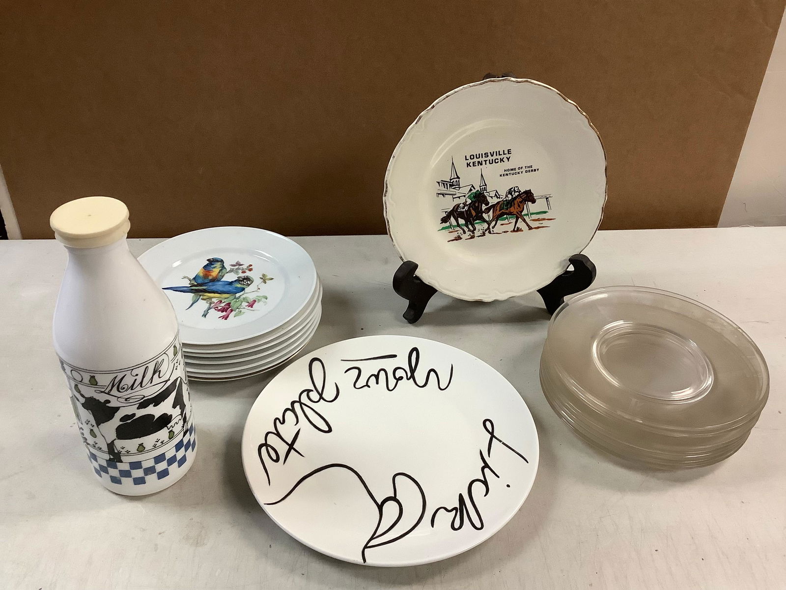 Lot of glass milk bottle 10.25in, clear glass plates, KUBA PORZELLAN bird plates, LOUISVILLE (1 of 1)