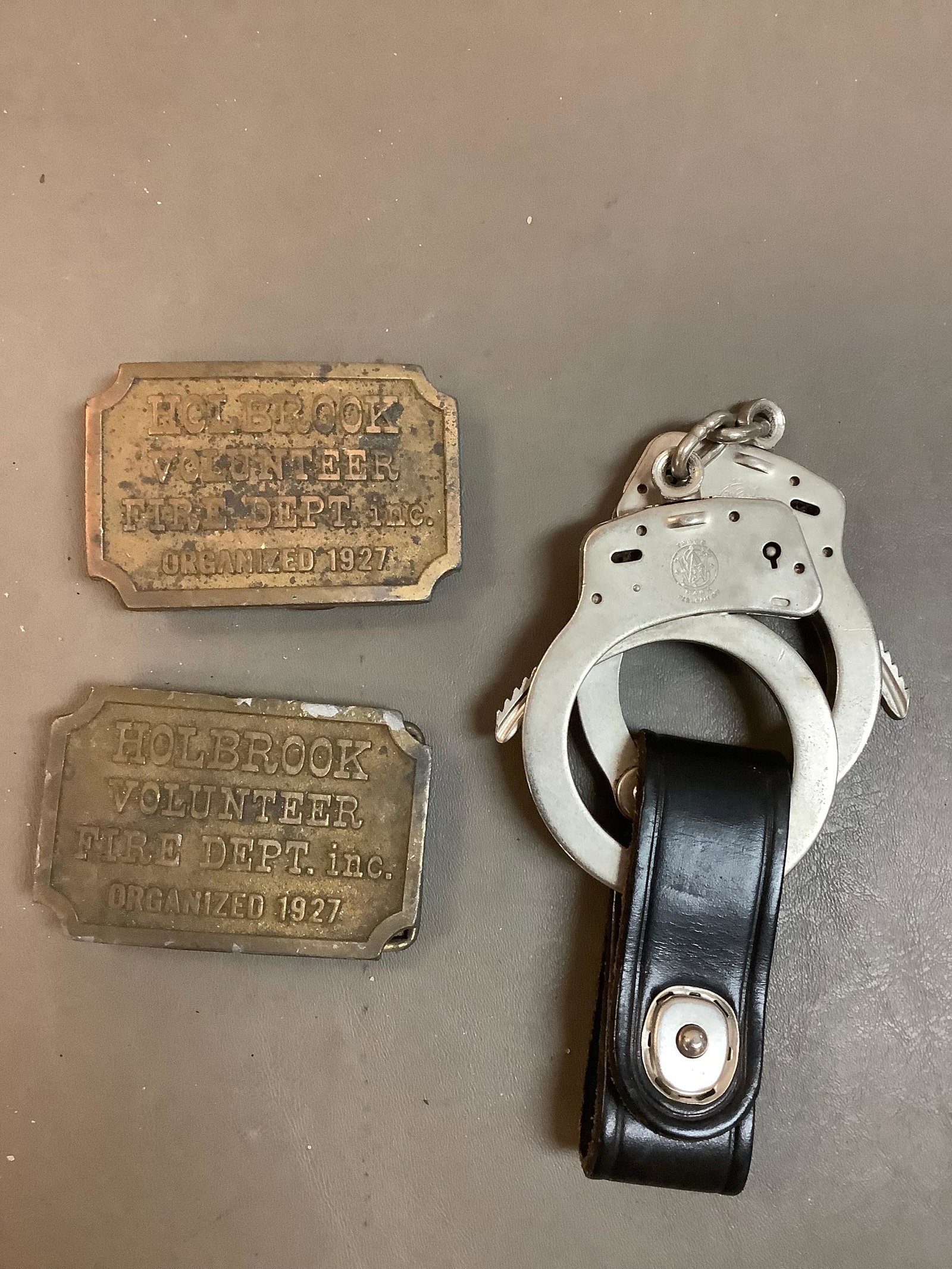 Lot of Brass FireFighter Belt Buckles and Handcuffs: Lot of Brass FireFighter Belt Buckles and Handcuffs