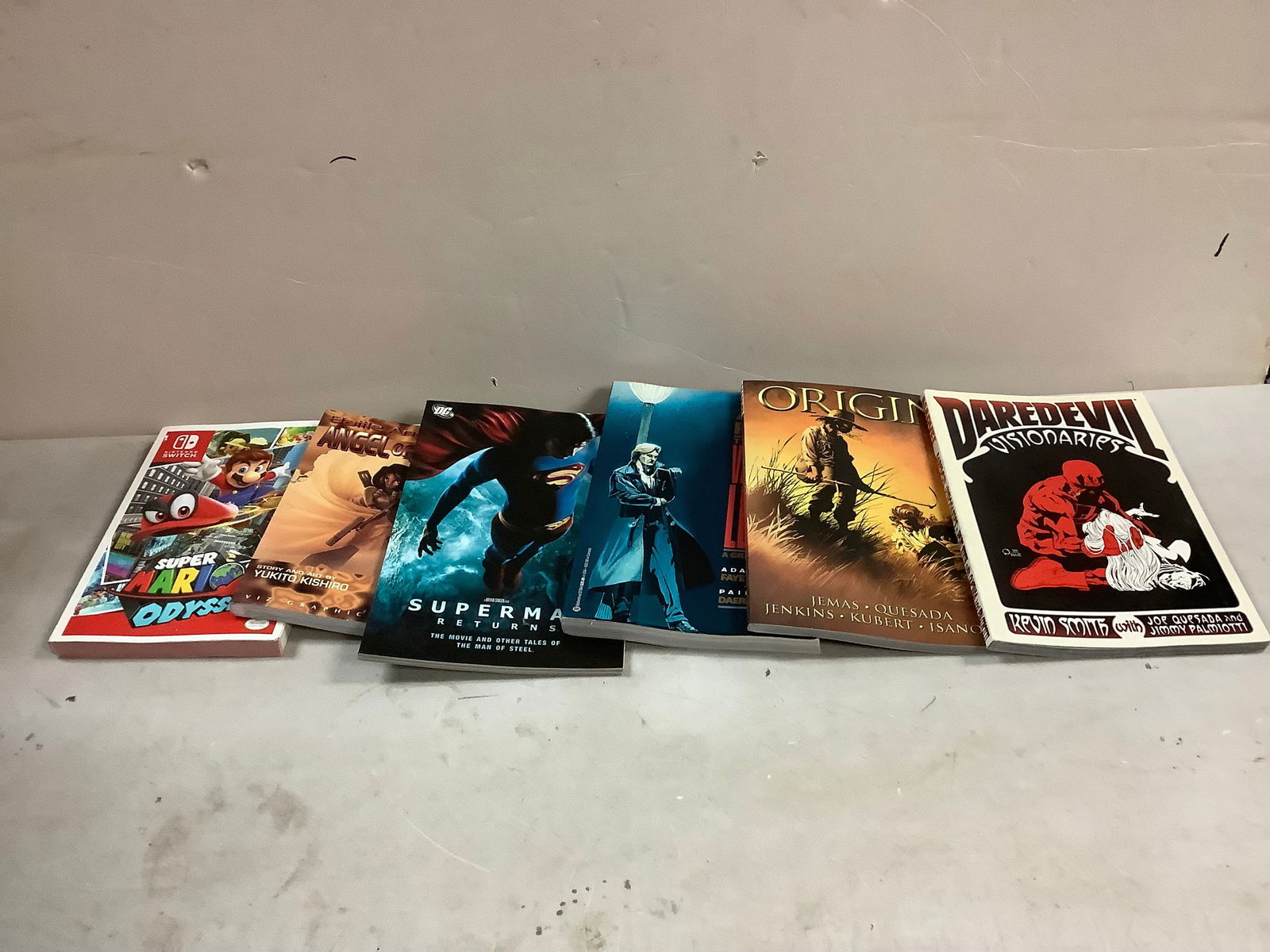 Lot of Comic Books and Super Mario Odyssey Book (1 of 1)