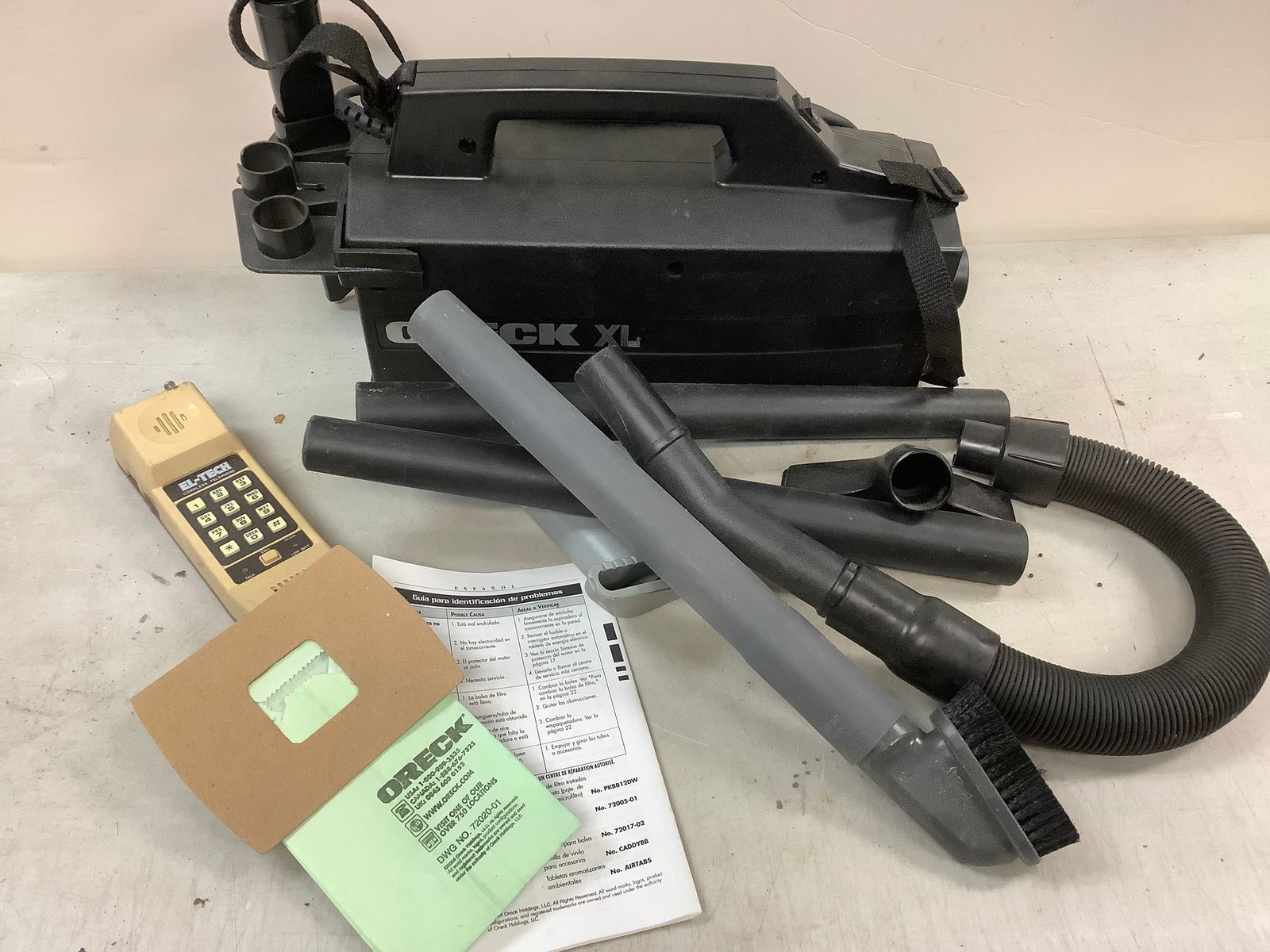 Oreck XL compact canister vaccuum and vintage El-Tech cordless telephone: Oreck XL compact canister vaccuum and vintage El-Tech cordless telephone