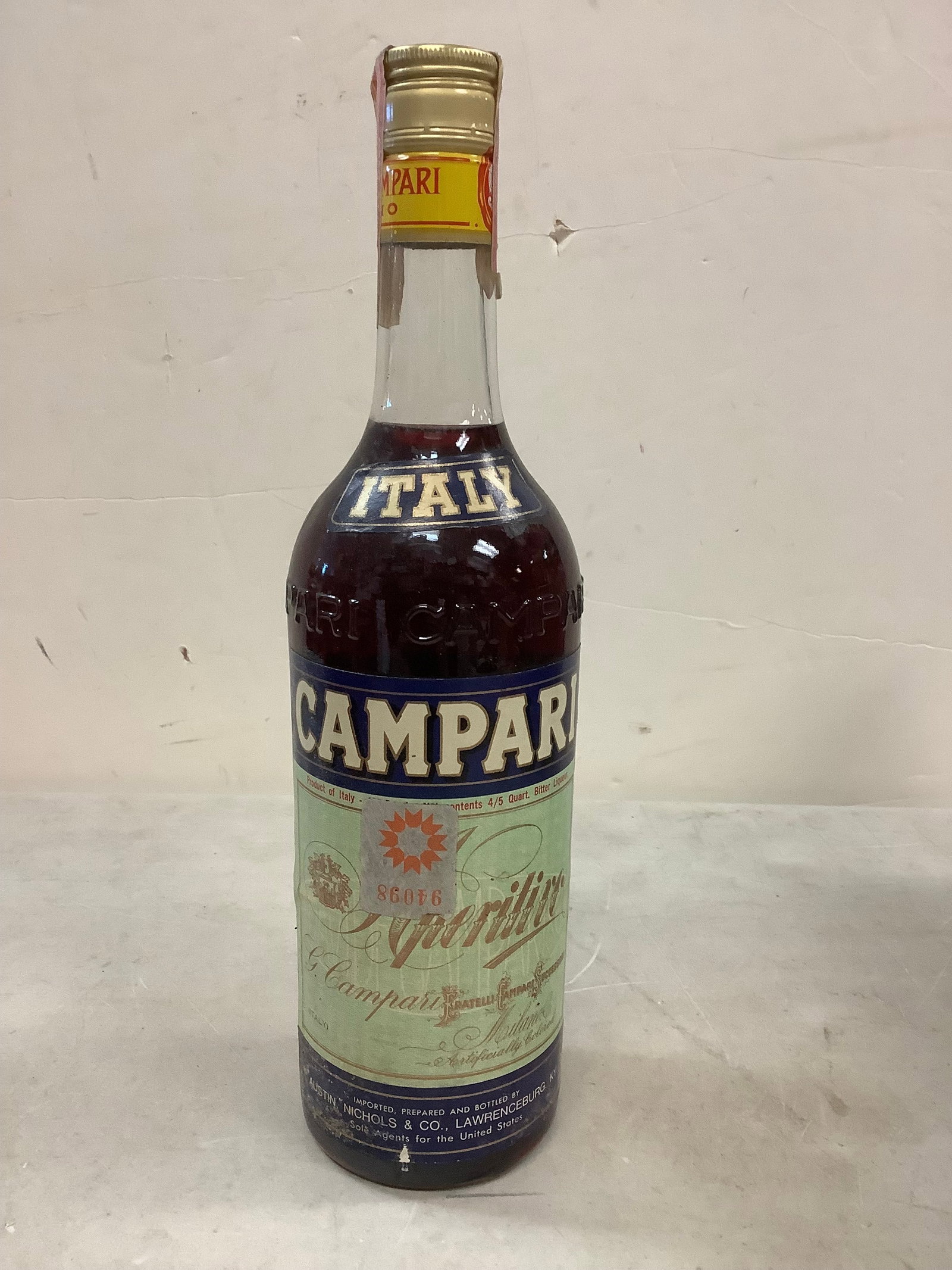 Italy Campari 4/5 of a quart: Any contents in bottle is Free; You are bidding on the bottle & unbroken tax stamp