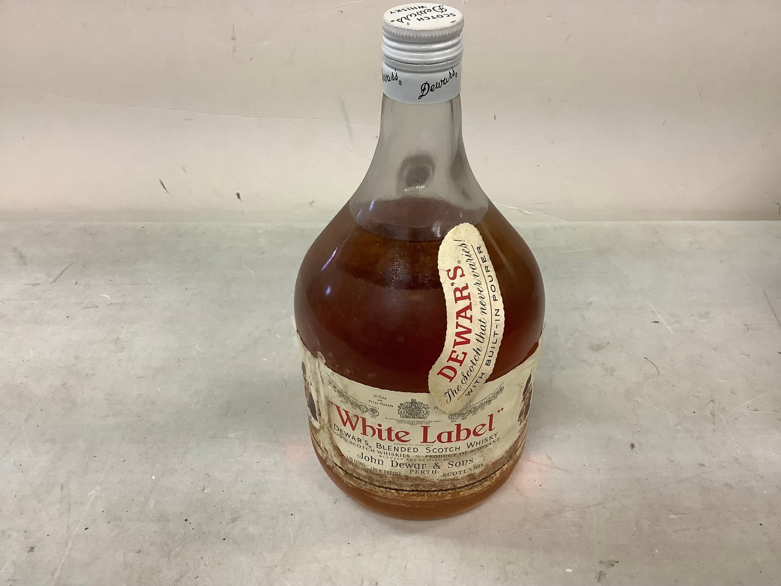 Dewar's White Label Blended Scotch Whisky: Any contents in bottle is Free; You are bidding on the bottle & unbroken tax stamp