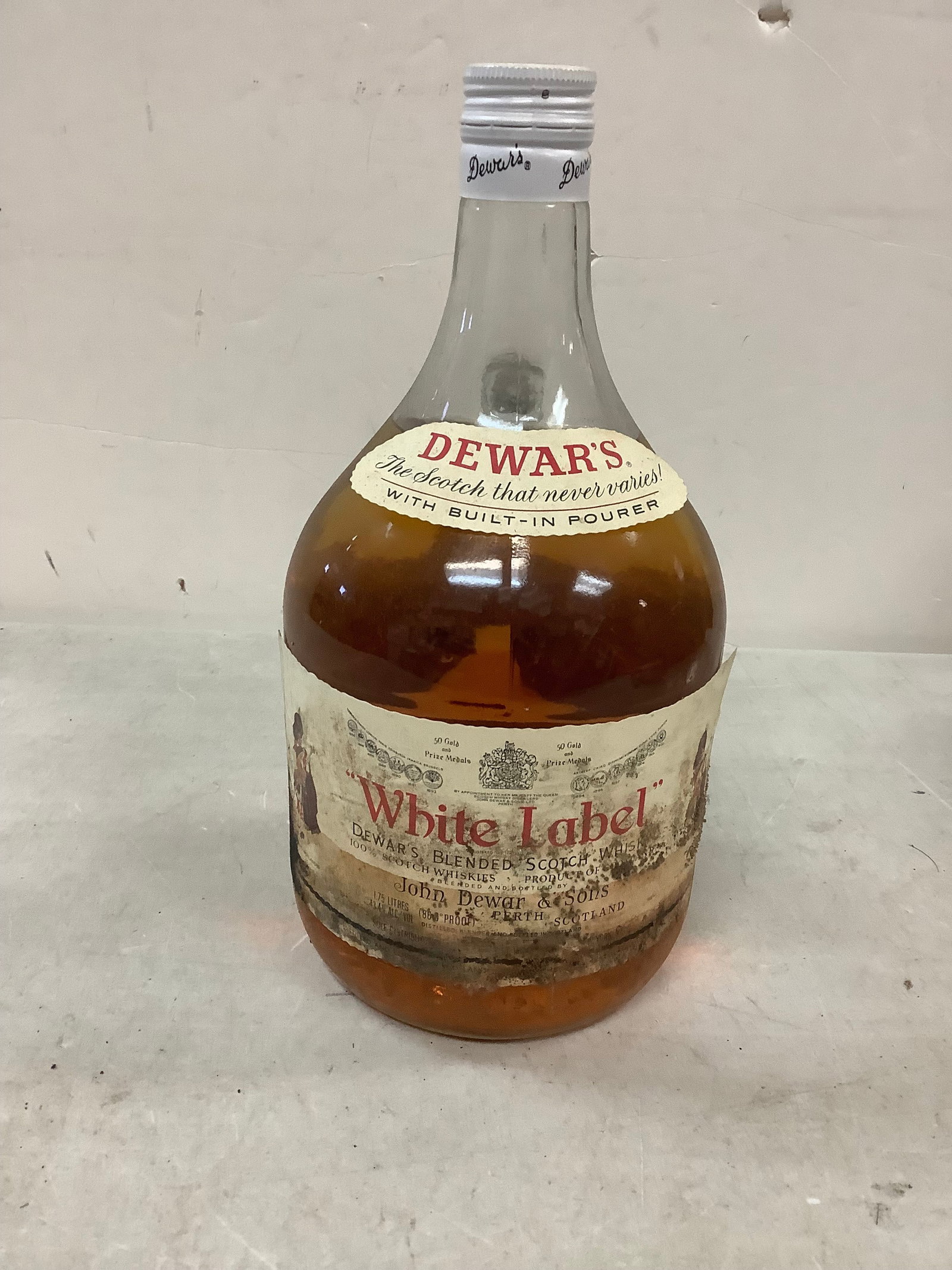 Sealed Dewar's White Label Blended Scotch Whisky: Any contents in bottle is Free; You are bidding on the bottle & unbroken tax stamp