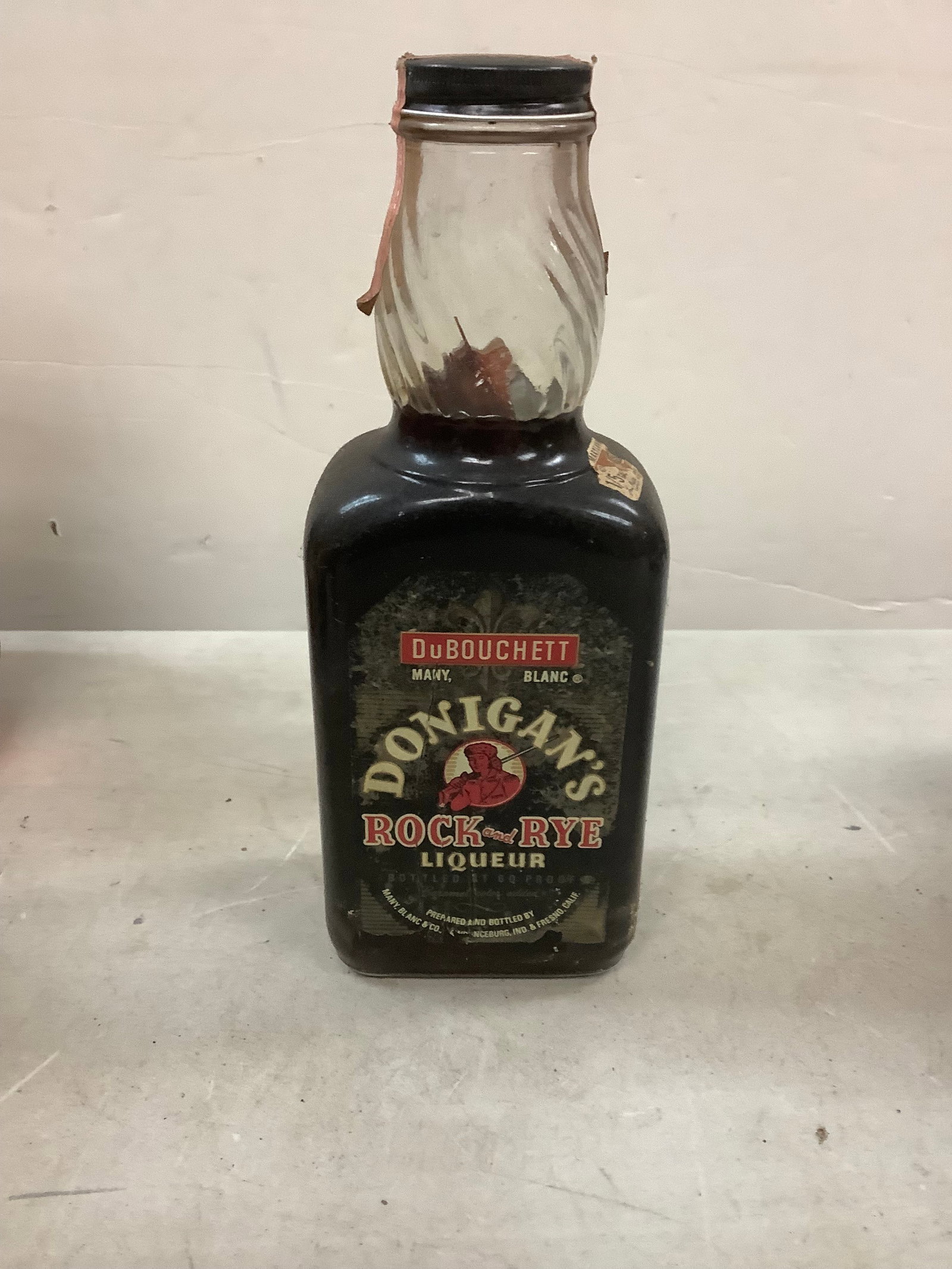 DuBouchett Donigan's Rock And Rye Liqueur: Any contents in bottle is Free; You are bidding on the bottle & unbroken tax stamp