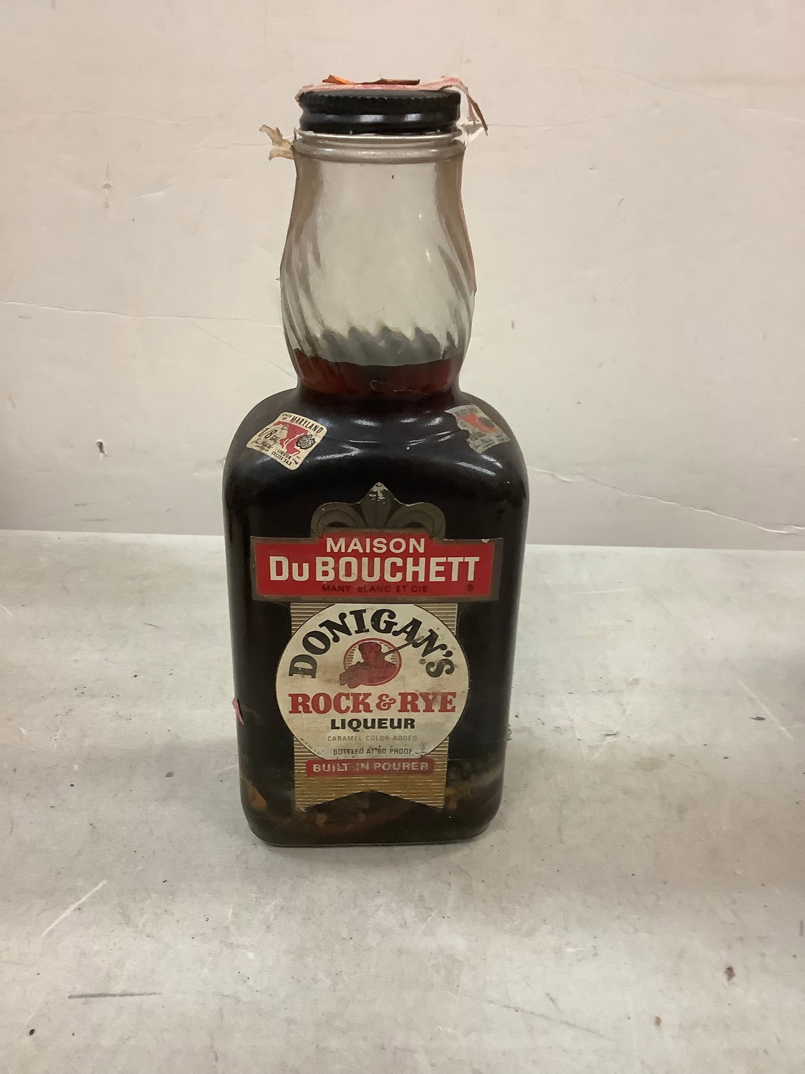 Mason Du Bouchett Donigan's Rock And Rye Liqueur: Any contents in bottle is Free; You are bidding on the bottle & unbroken tax stamp