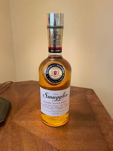 Old Smuggler Blended Scotch Whisky1 Qote with tax stamp sealed with sealed tax stamp: Any contents in bottle is Free; You are bidding on the bottle & unbroken tax stamp