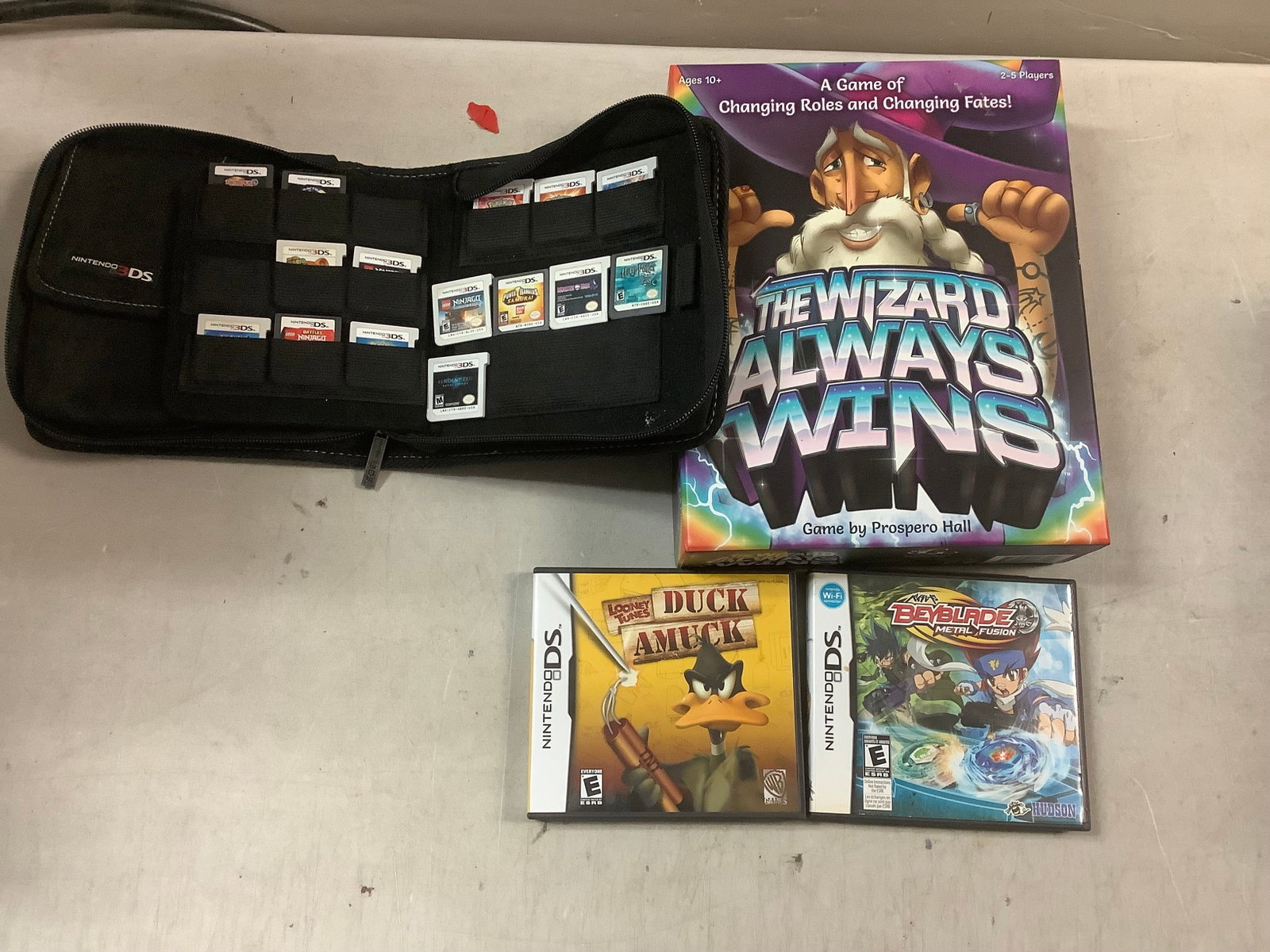 Lot of Nintendo 3DS & DS games with games holder and board game: Lot of Nintendo 3DS & DS games with games holder and board game