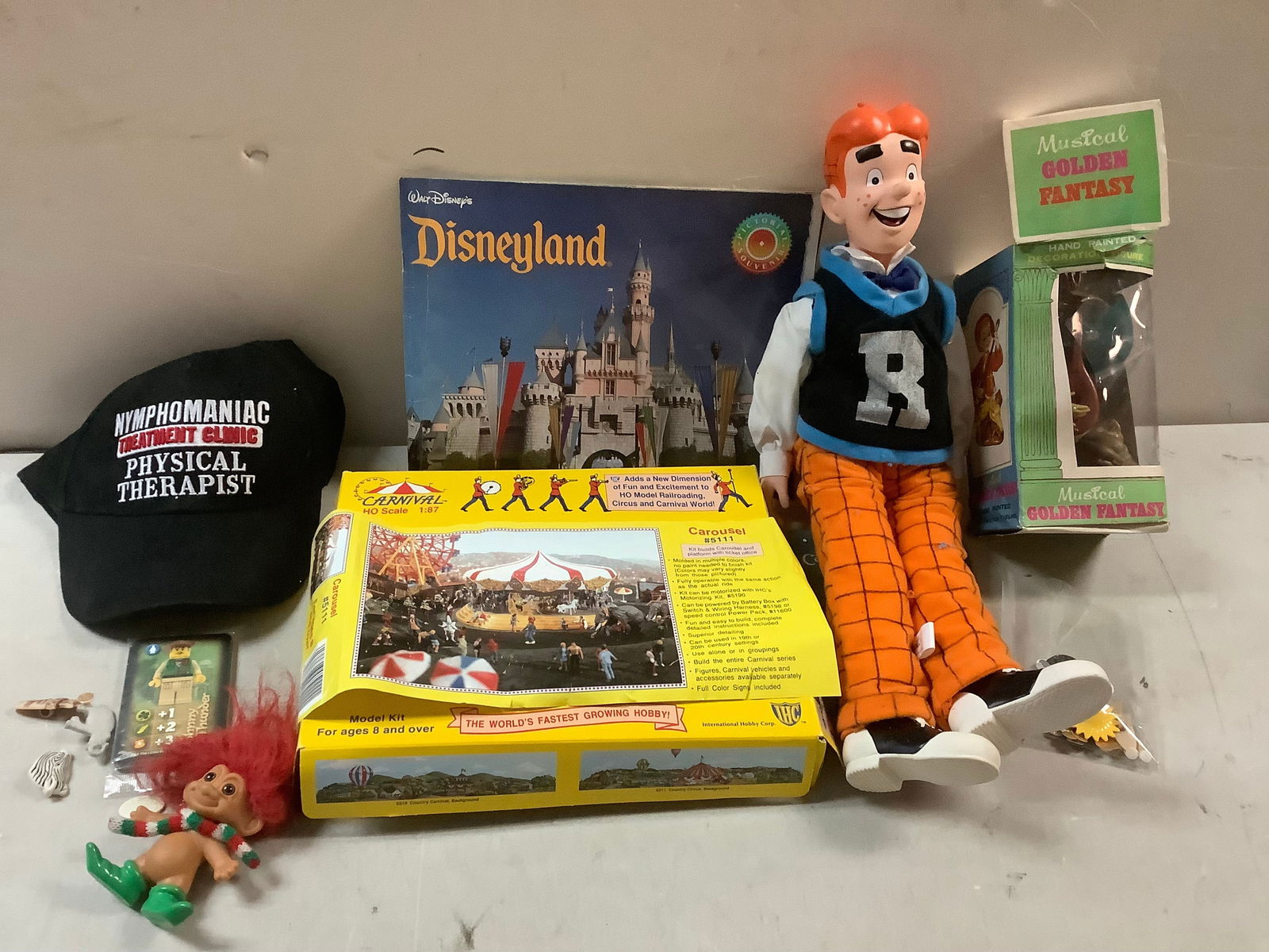 Lot of disneyland book, hand-painted figurine, carousel model and more (1 of 1)