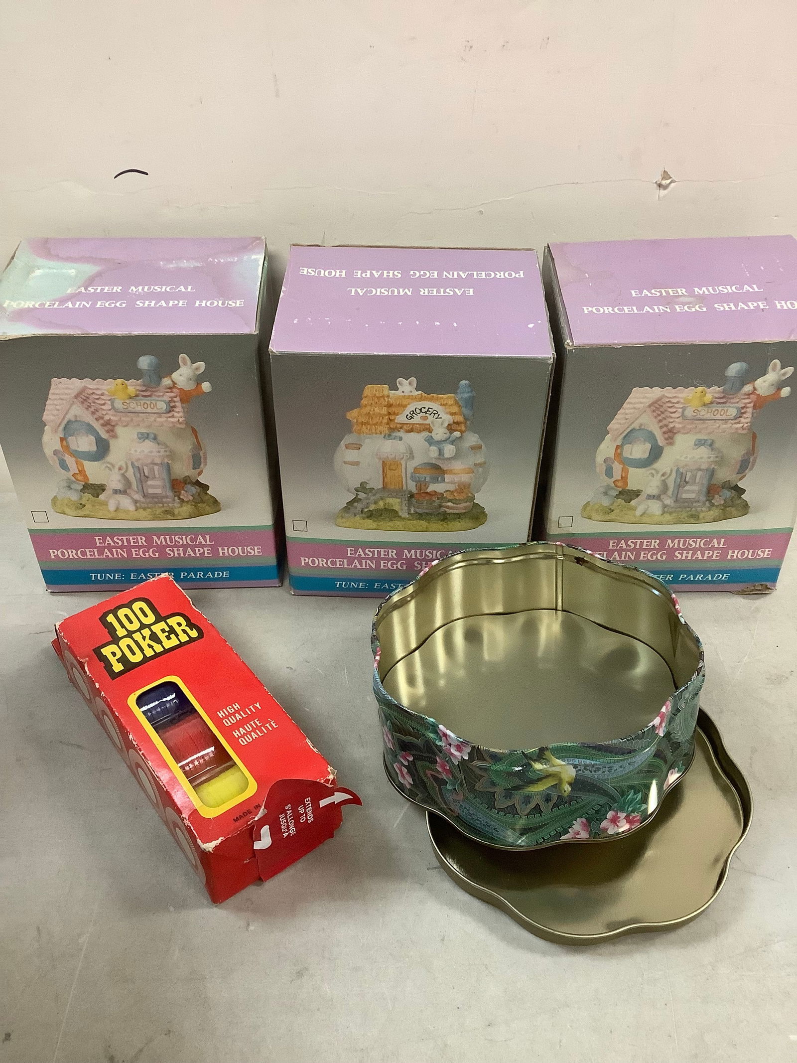 Lot of easter porcelain musical egg houses, decorative tin, and poker chips (1 of 1)