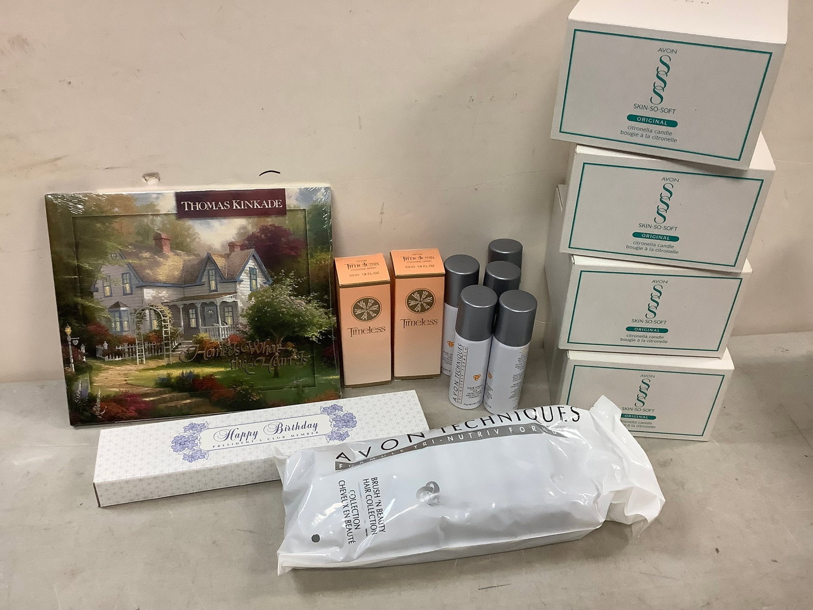 Lot of Hairspray, hairbrush, cologne, citronella candles, home is where the heart is book: Lot of Hairspray, hairbrush, cologne, citronella candles, home is where the heart is book