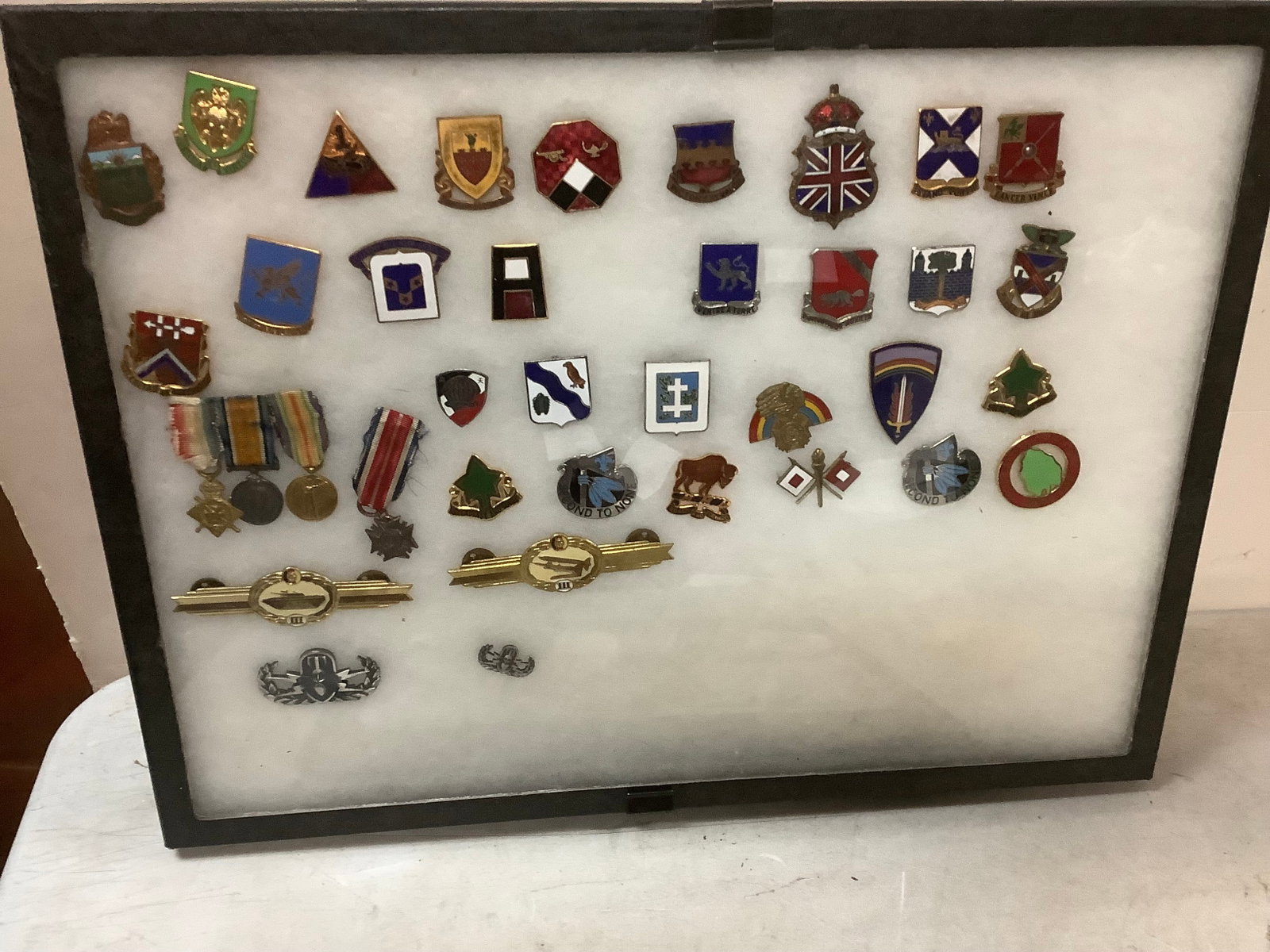 Lot of framed historic pins: Lot of framed historic pins