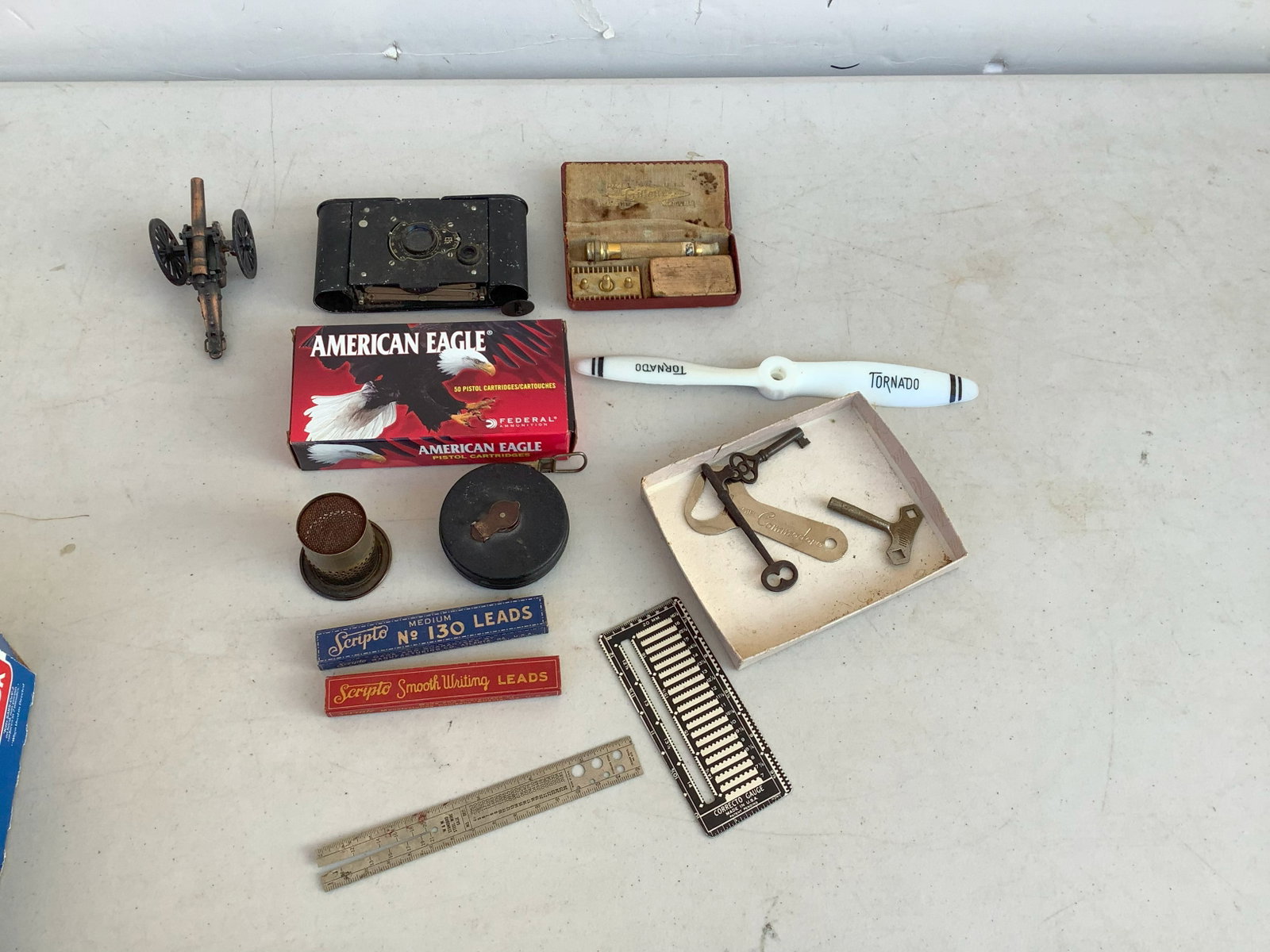 American Eagle 50 Pistol Cartridges, Kodak Vest Pocket Vintage Camera, Vinatge Gilette Travel Razor: American Eagle 50 Pistol Cartridges, Kodak Vest Pocket Vintage Camera, Vinatge Gilette Travel Razor Kit, Canon Pencil Sharpener, Old Keys and more
