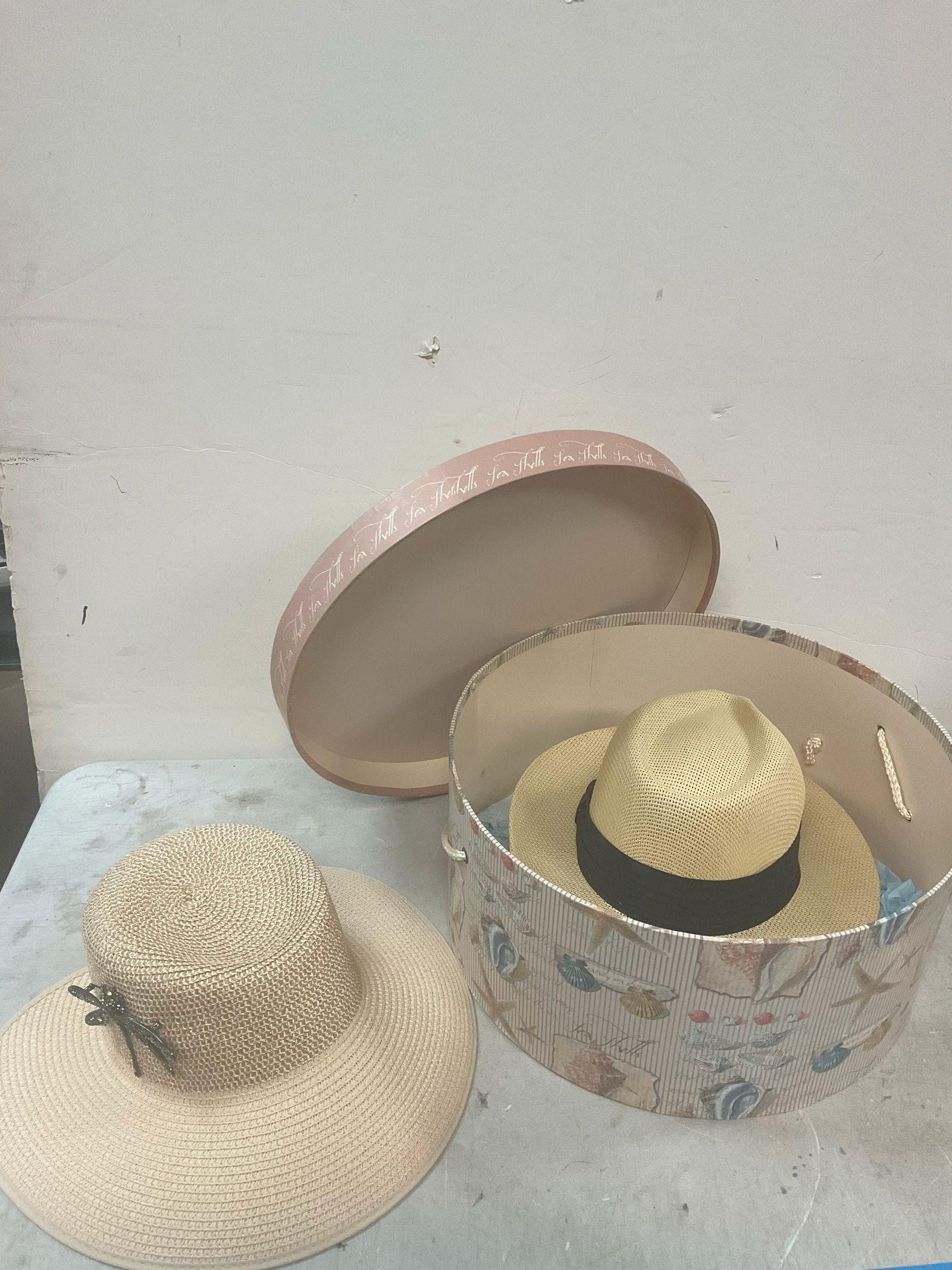Decorative seashell box full of with hats inside (1 of 1)