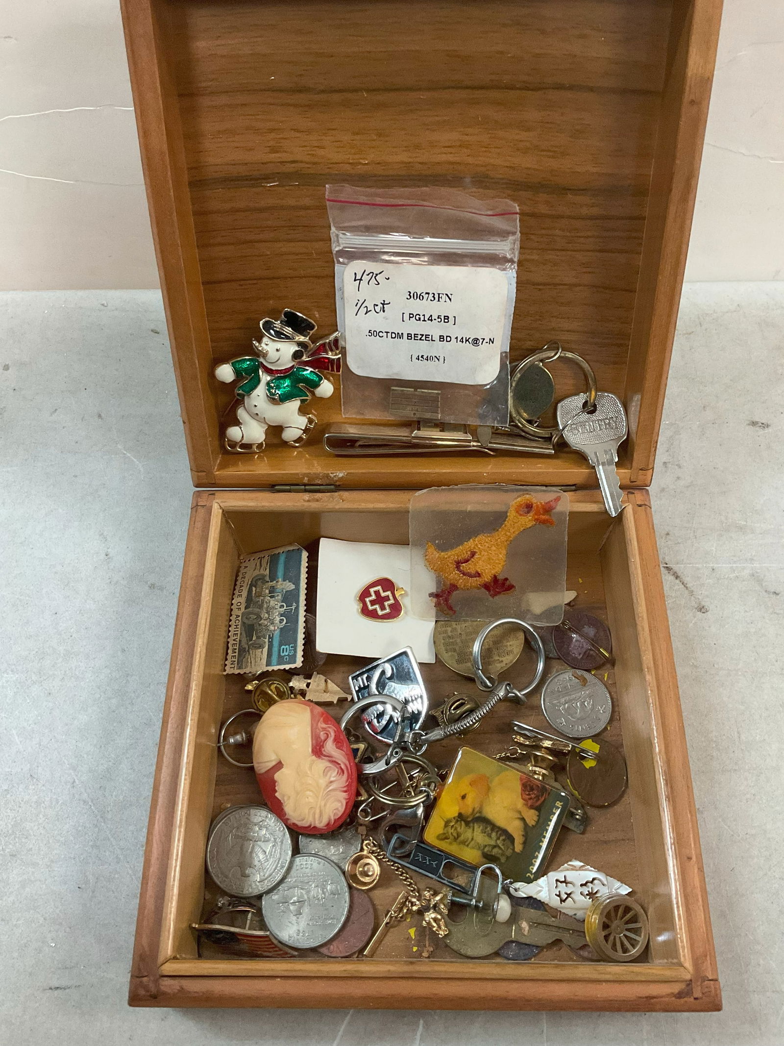 Wooden box of pins, keychains, and more: Wooden box of pins, keychains, and more