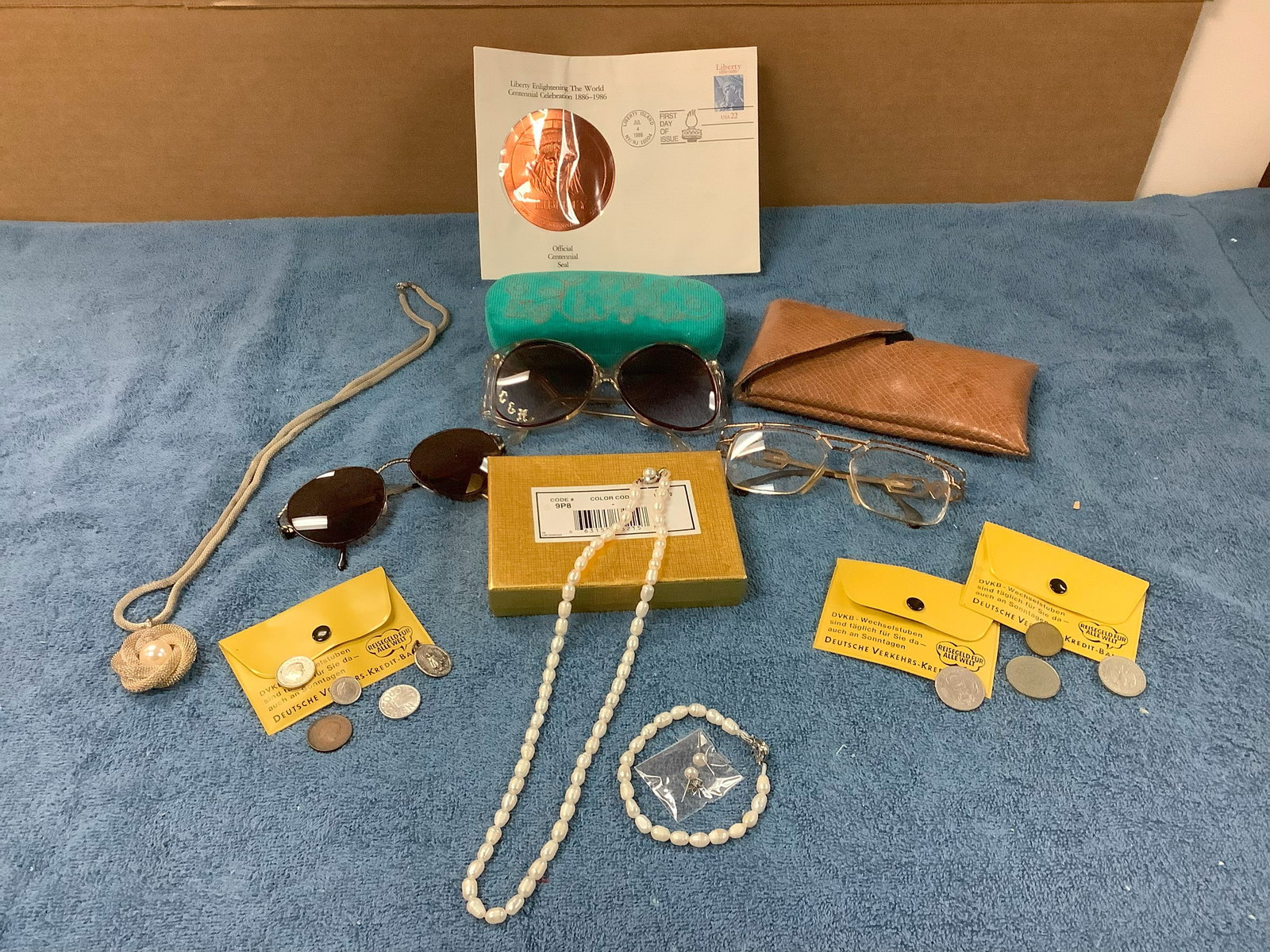 Official Centennial Seal, Fendi Sunglasses, Sunglasses with Case, Deutsche Bank Change Holder, Gazal: Official Centennial Seal, Fendi Sunglasses, Sunglasses with Case, Deutsche Bank Change Holder, Gazal Glasses, Set of Costume Jewelry, etc.