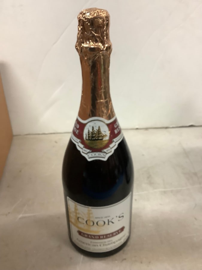 Cook's Grand Reserve Extremely Dry American Champagne: Any contents in bottle is Free; You are bidding on the bottle & unbroken tax stamp