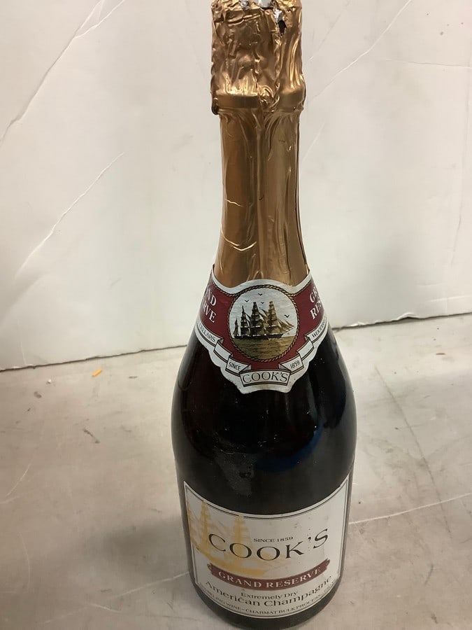 Cook's Grand Reserve Extremely Dry American Champagne: Any contents in bottle is Free; You are bidding on the bottle & unbroken tax stamp