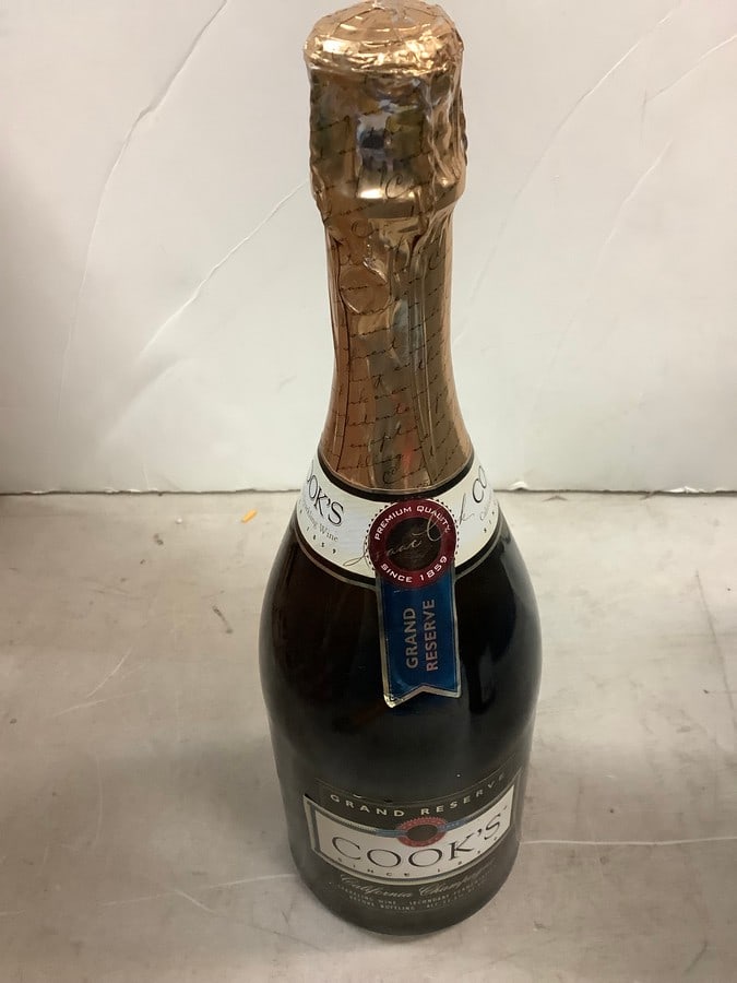 Cook's Grand Reserve Extremely Dry American Champagne: Any contents in bottle is Free; You are bidding on the bottle & unbroken tax stamp