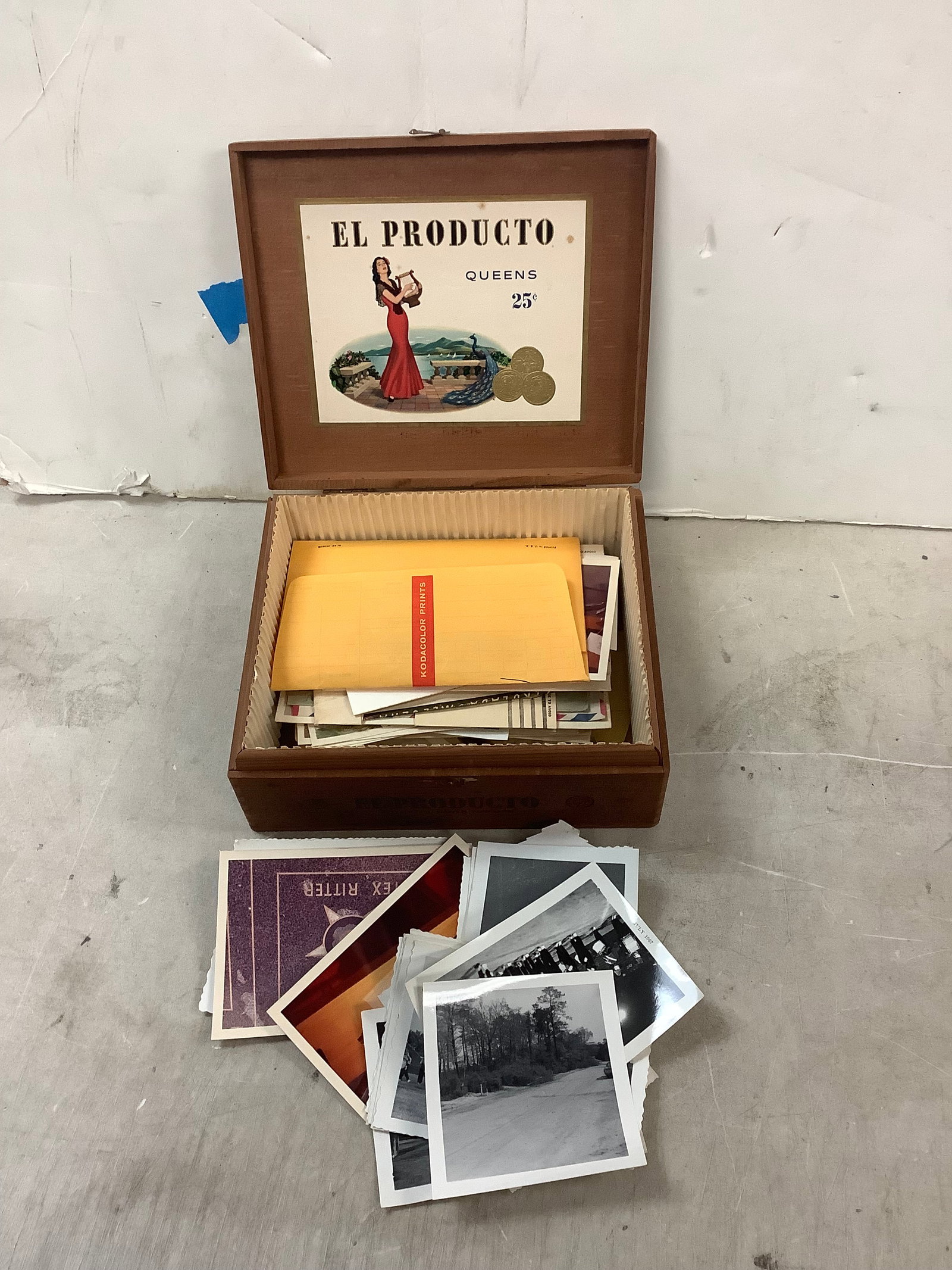 Cigar box filled with vintage photos: Cigar box filled with vintage photos