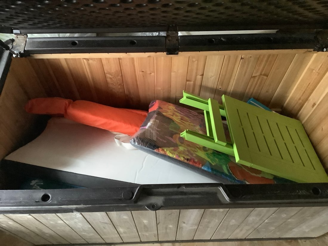 contents of storage chest - new boogie boards, used buggie board and life jackets: contents of storage chest - new boogie boards, used buggie board and life jackets