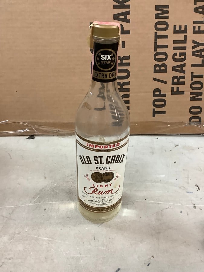 Imported White Old St. Croix Light Rum: Any contents in bottle is Free; You are bidding on the bottle & unbroken tax stamp