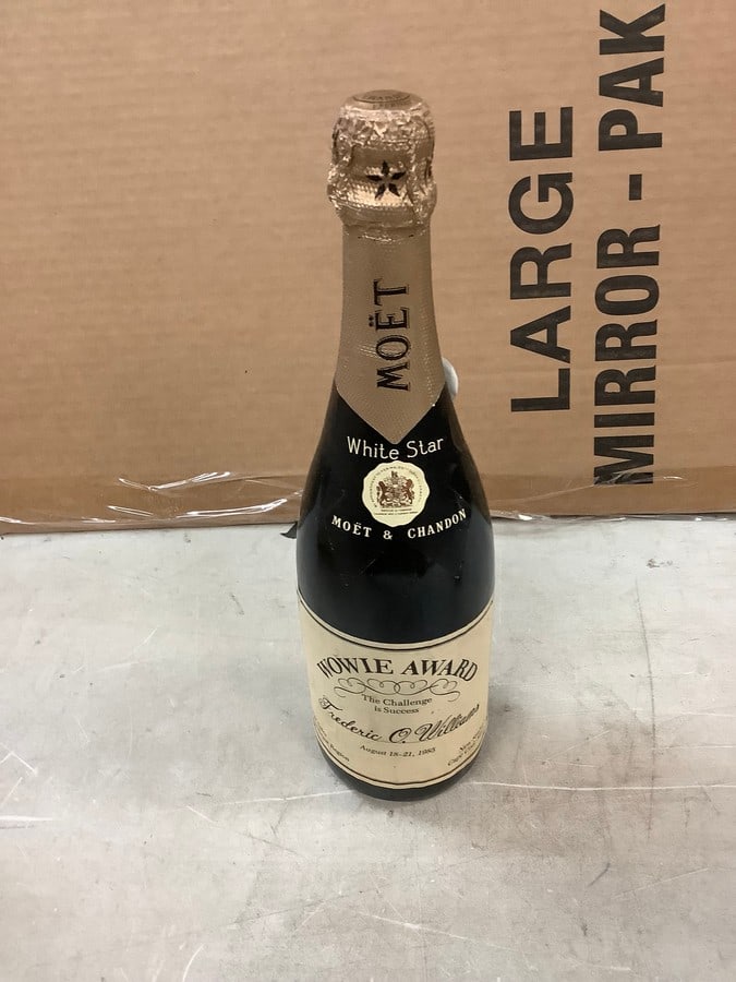 Moet Wowie Award Champagne Sealed: Any contents in bottle is Free; You are bidding on the bottle & unbroken tax stamp