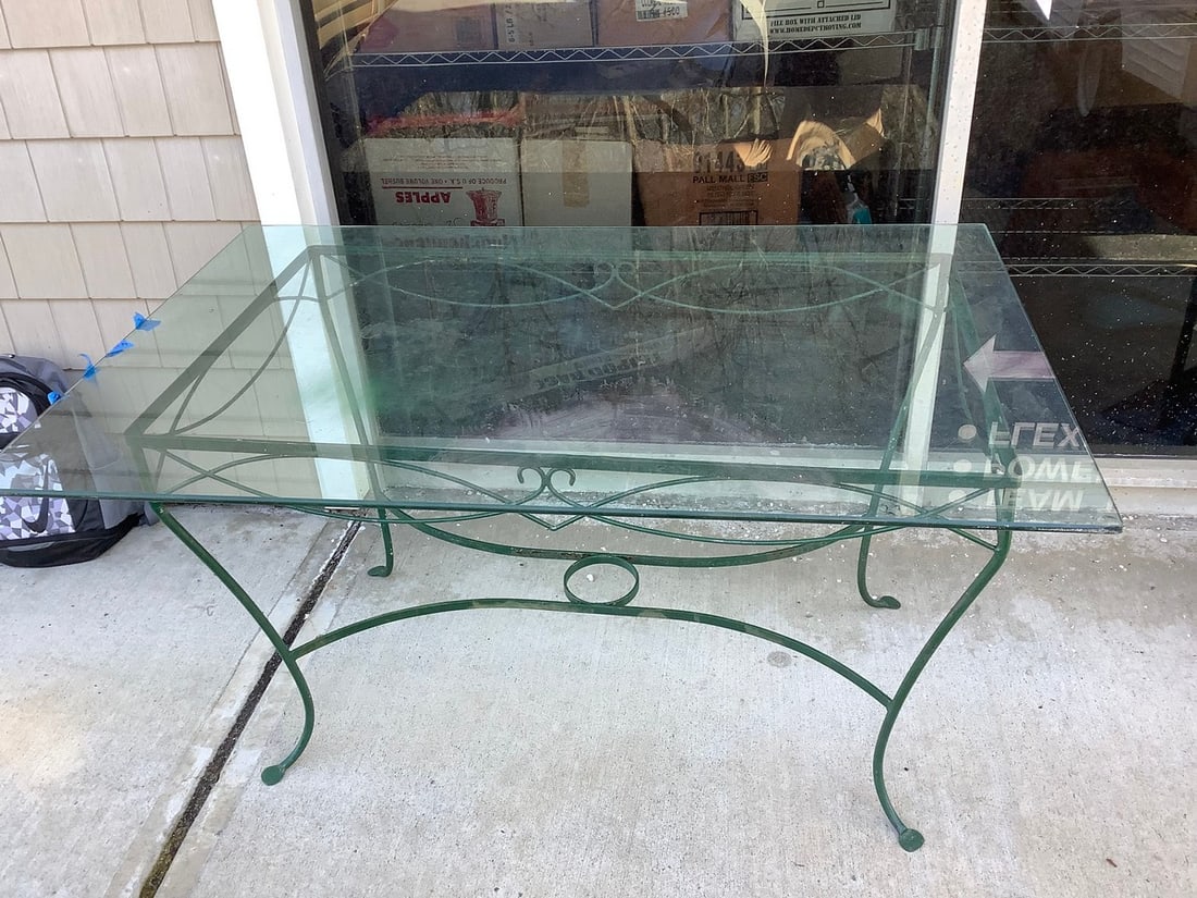 Heavy glass and metal patio table 58"x38": Heavy glass and metal patio table 58"x38"