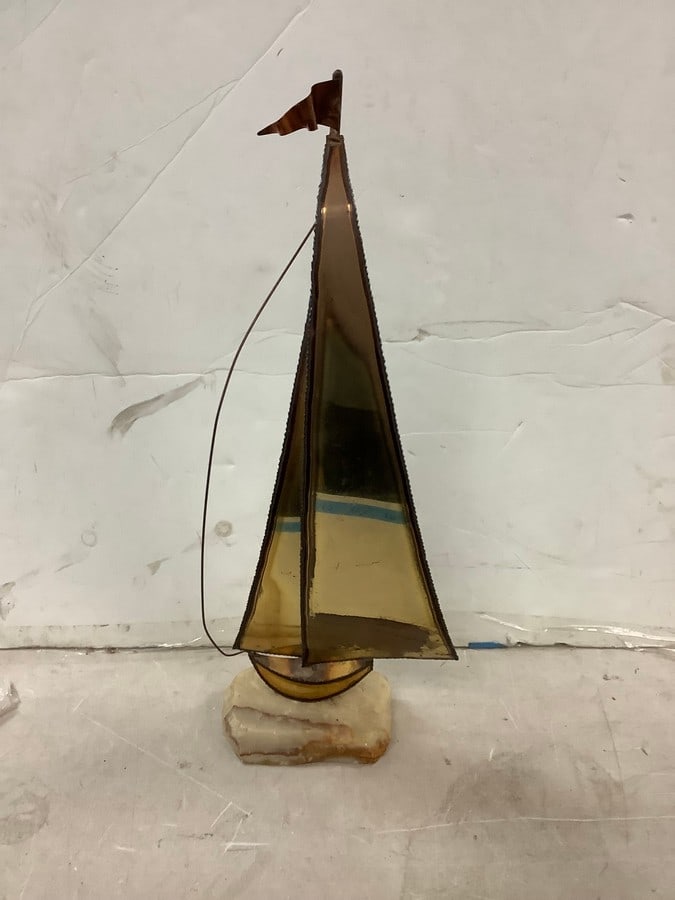 Brass boat on stone stand 22.5in tall: Brass boat on stone stand 22.5in tall