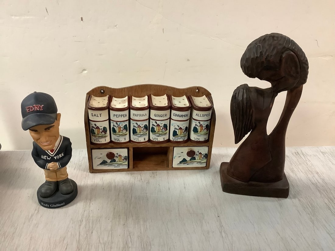 Lot of bookshelf salt and pepper shakers, FDNY bobblehead, and wooden kissing statue 11in.tall (1 of 1)