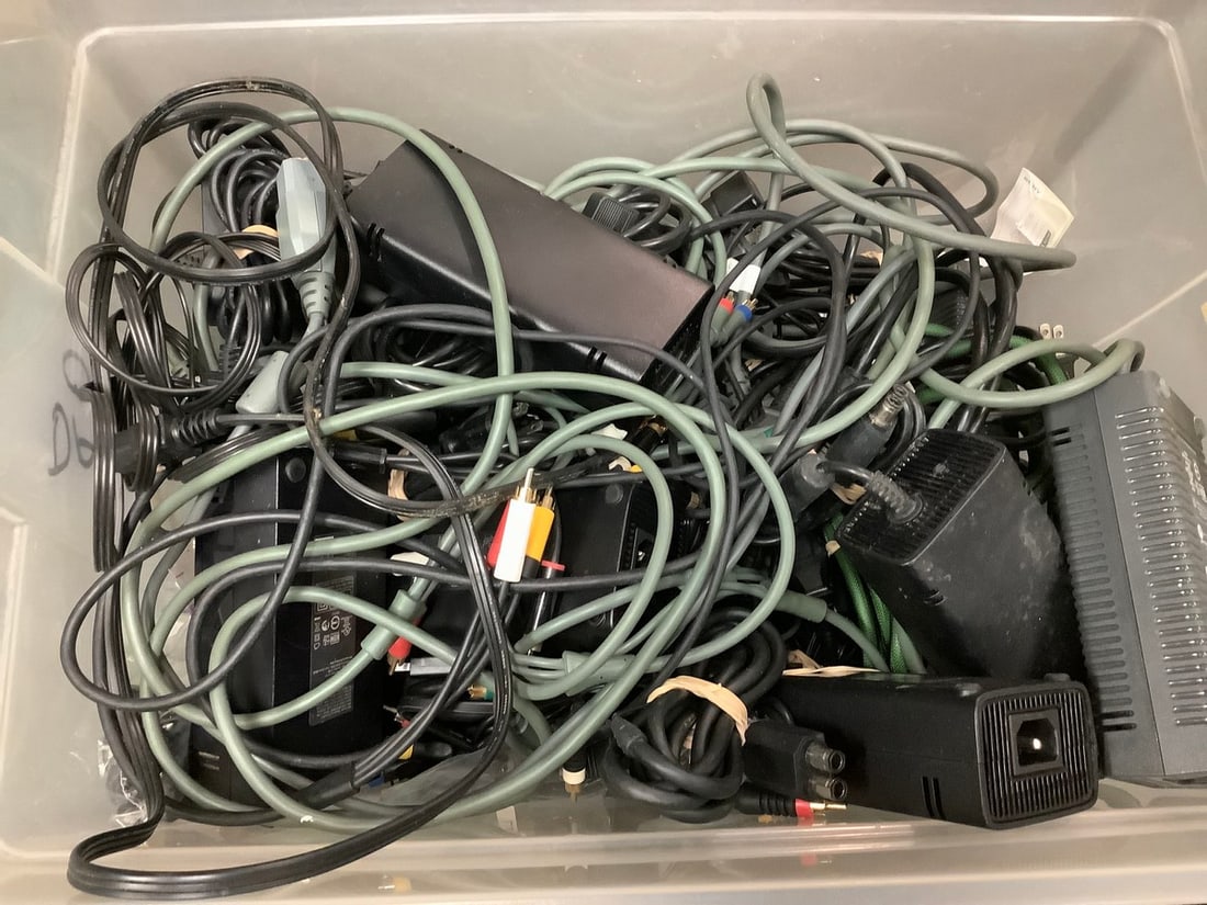 Tub of video game power supplies and cords (1 of 1)