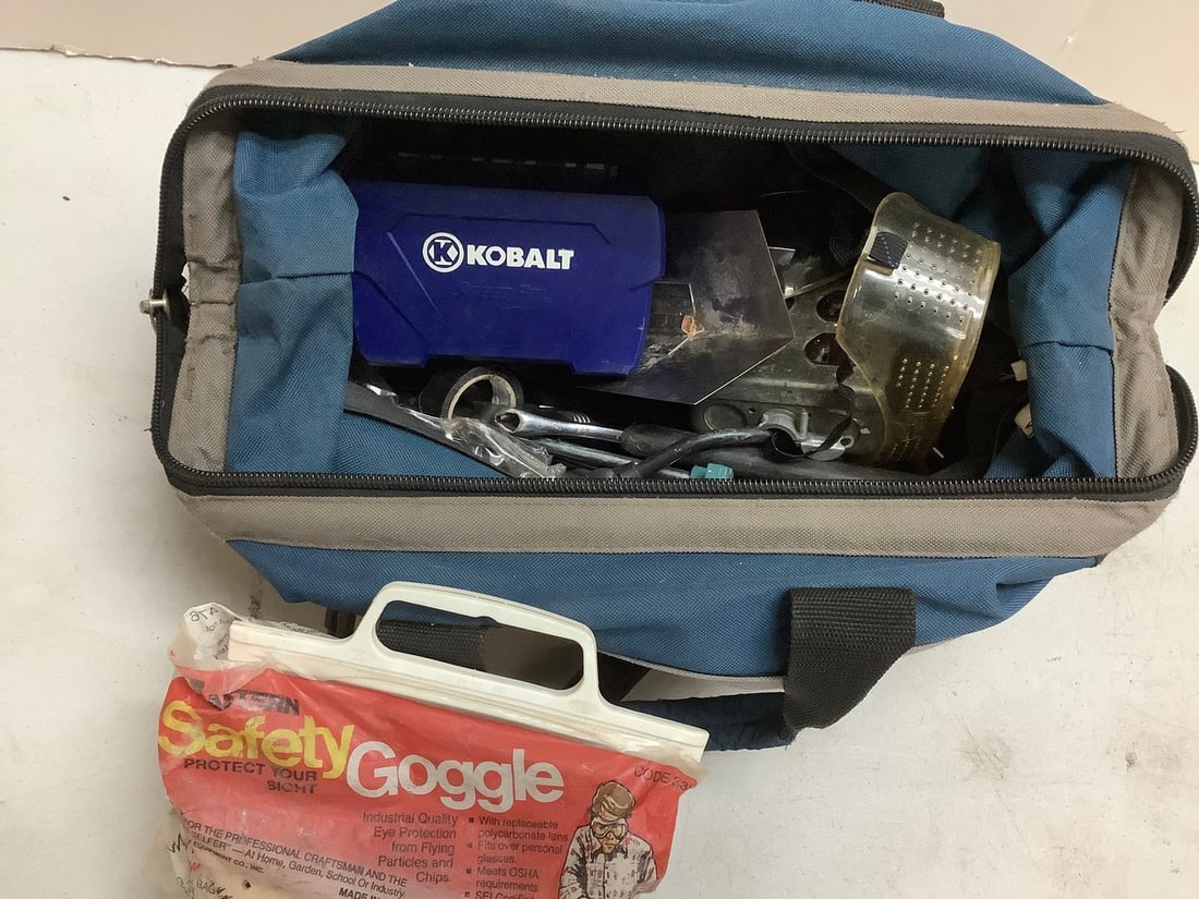 McGuire-Nicholas vintage bag filled with tools and safety goggles (1 of 1)