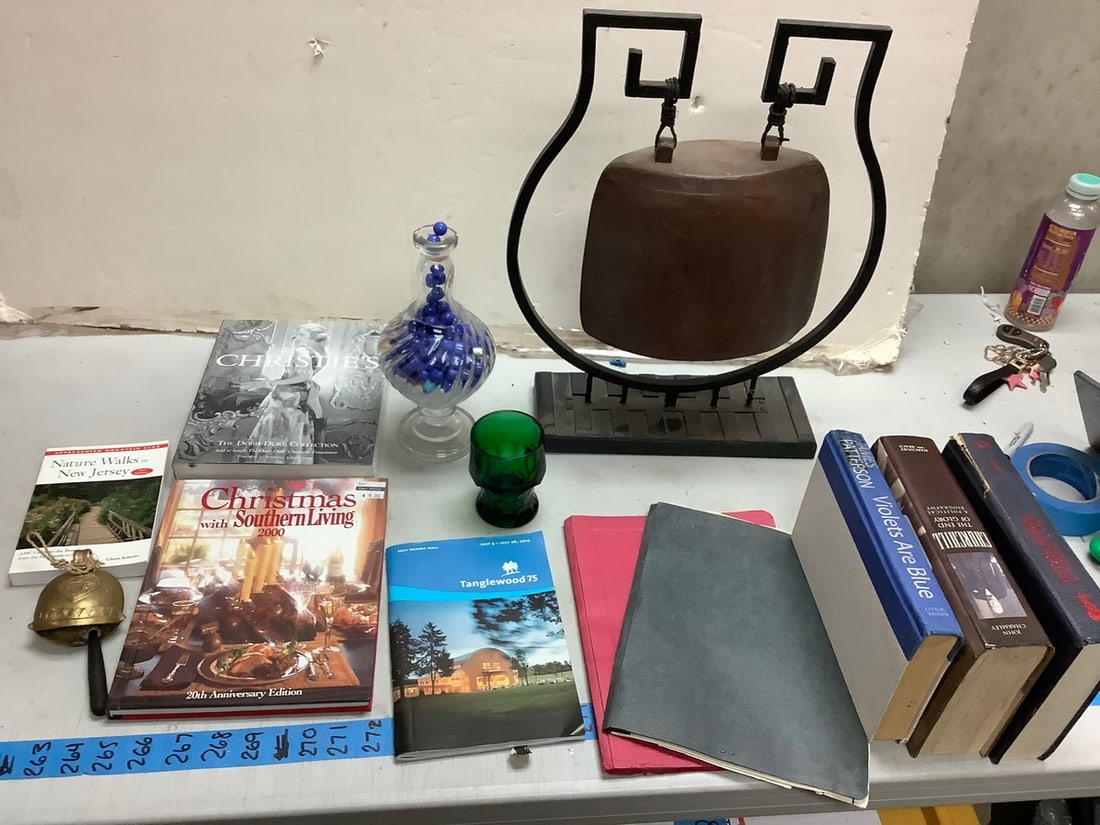 Lot of books, jar of marbles, gong (19in tall), green glass cup, and more. (1 of 1)