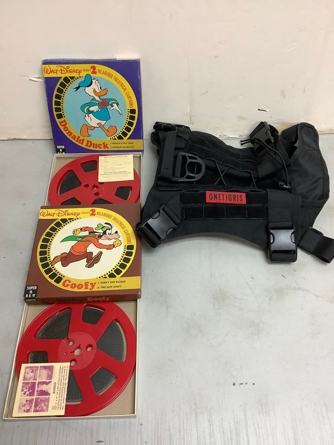 Vintage Walt Disney film reels and Onetigris dog vest: Vintage Walt Disney film reels and Onetigris dog vest