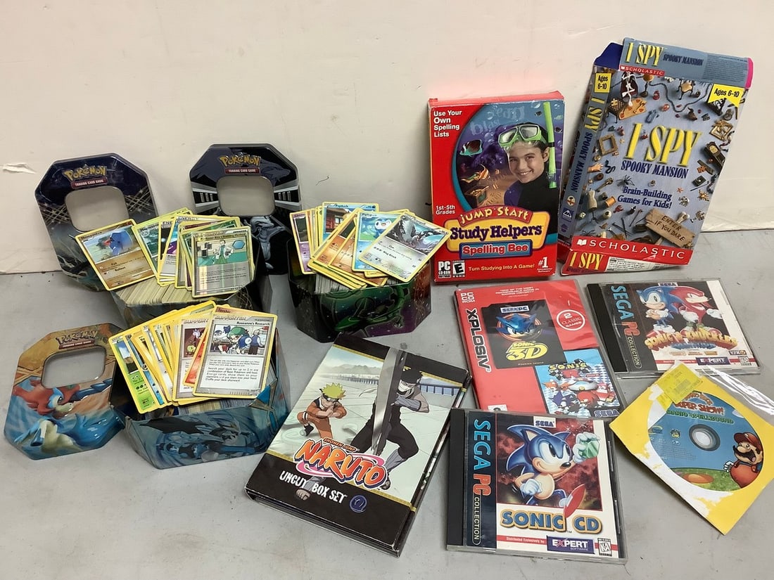 Pokemon tin containers filled with pokemon cards, Naruto uncut box set, Sega PC Sonic CD's, and more (1 of 1)