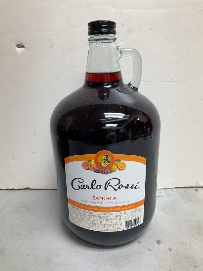 Carlo Rossi Sangria(4L): Any contents in bottle is Free; You are bidding on the bottle & unbroken tax stamp