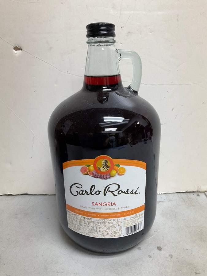 Carlo Rossi Sangria(4L): Any contents in bottle is Free; You are bidding on the bottle & unbroken tax stamp