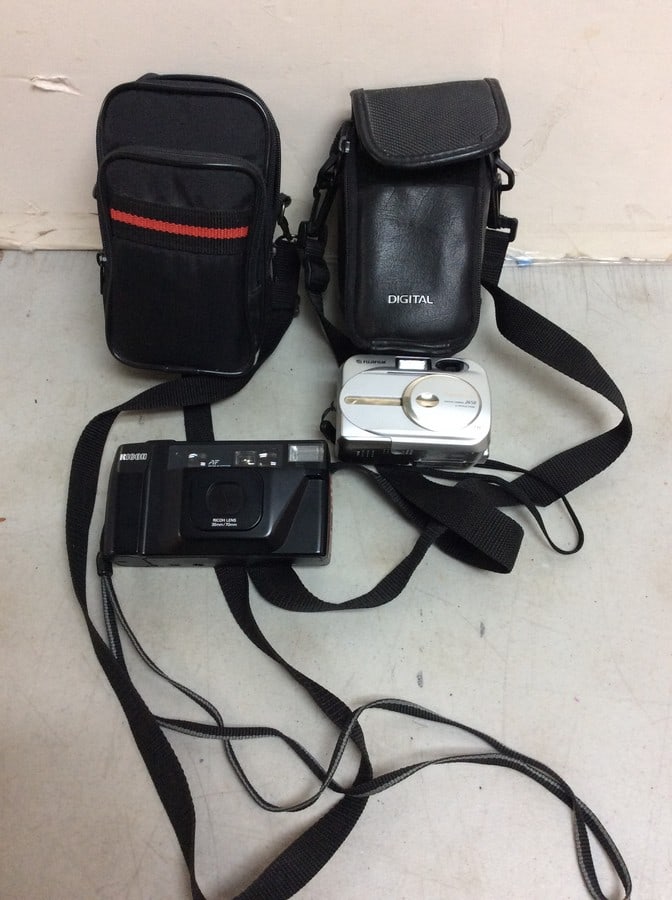 Fujifilm and Ricoh cameras with carrying cases (1 of 1)