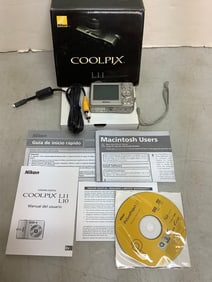 Coolpix L11 Nikon camera and papers in original box