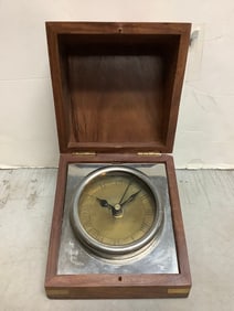 Brass clock in wood case(4.5in.x4.5in.x3.5in.)
