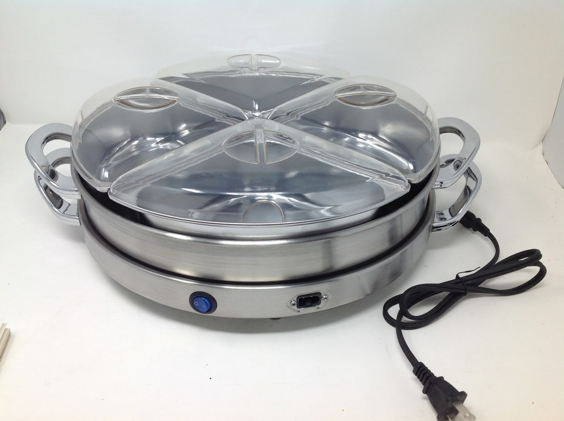Never used, 4 compartment lazy susan buffet warmer, model # 06029 120v, 60hz, 80 watt, 14??x6: Never used, 4 compartment lazy susan buffet warmer, model # 06029 120v, 60hz, 80 watt, 14”x6”