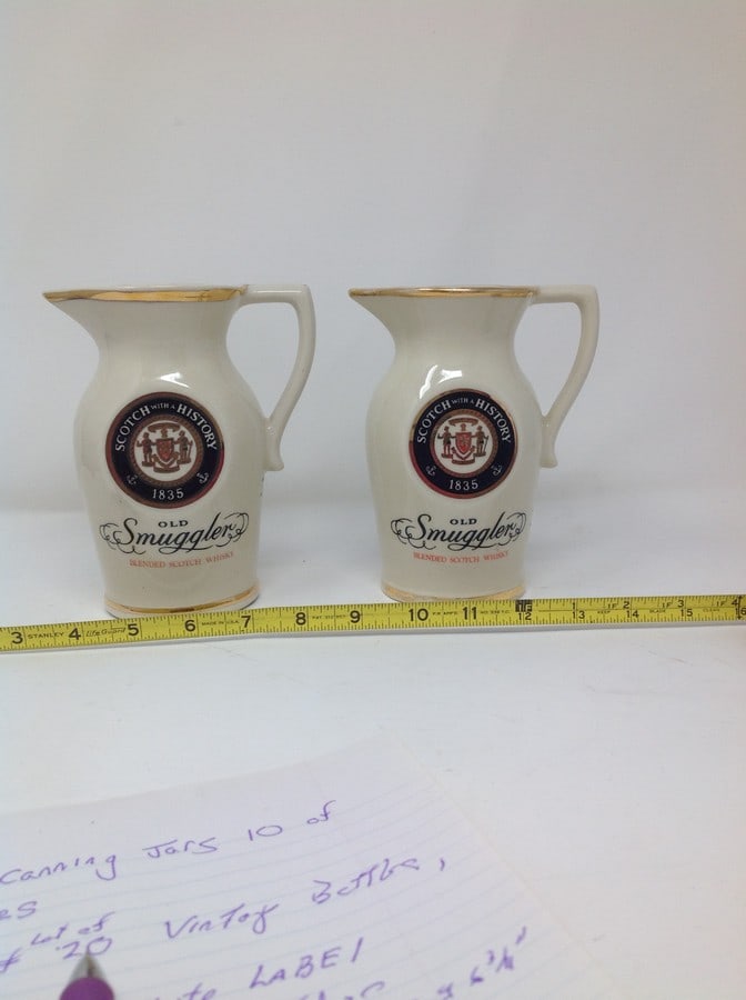 Lot of 2 scotch with a history 1835, old smuggler blended pitchers, scotch whisky by alan insulated (1 of 1)