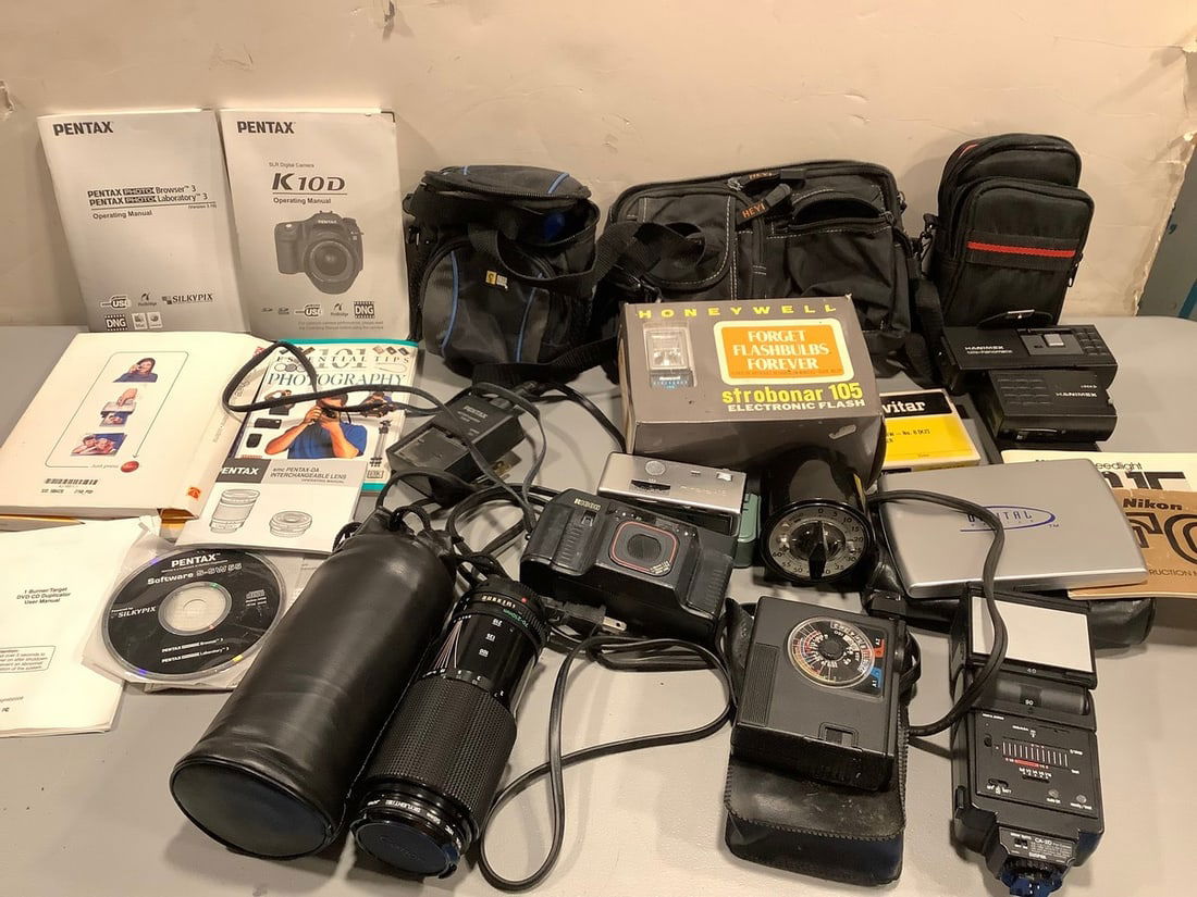Various camera manuals, travel bag carrying cases,flash attachments, darkroom timer, and more (1 of 1)